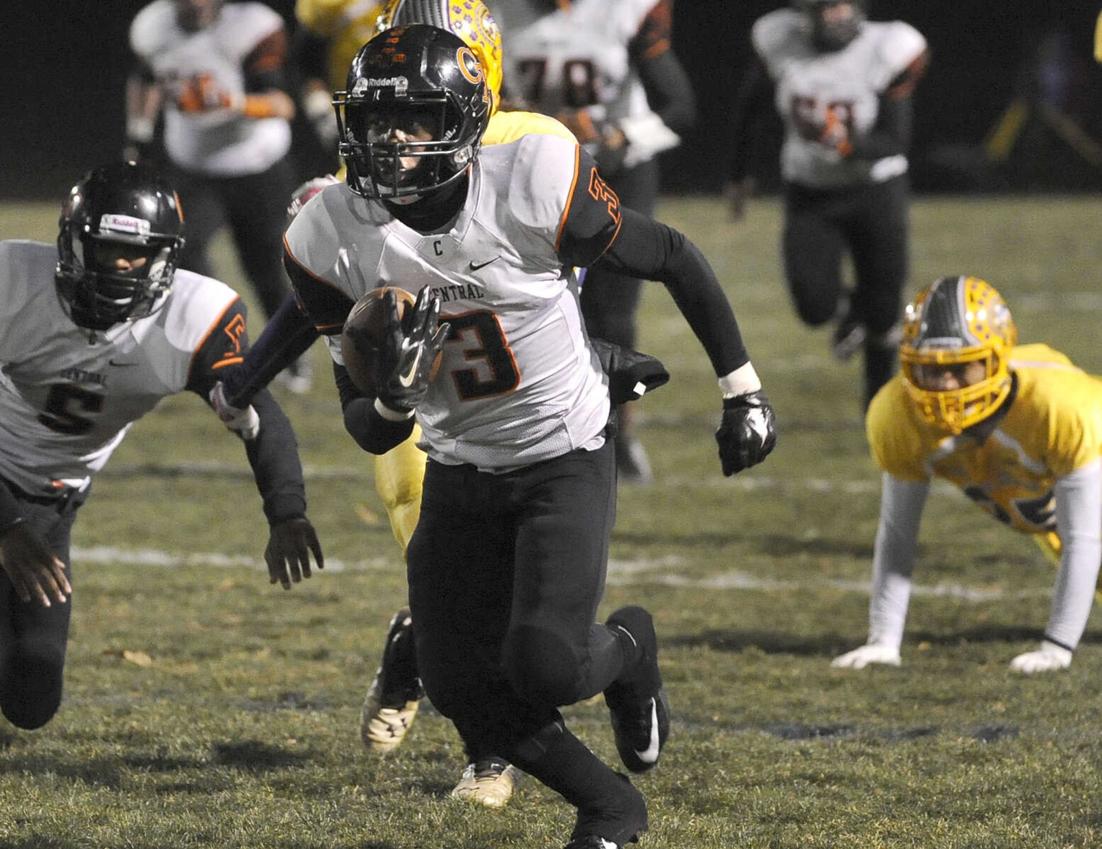 Central defensive back Jaylen Reddin carries away from Affton during the second quarter of the Class 4 state quarterfinal Friday, Nov. 14, 2014 in Affton, Missouri. (Fred Lynch)