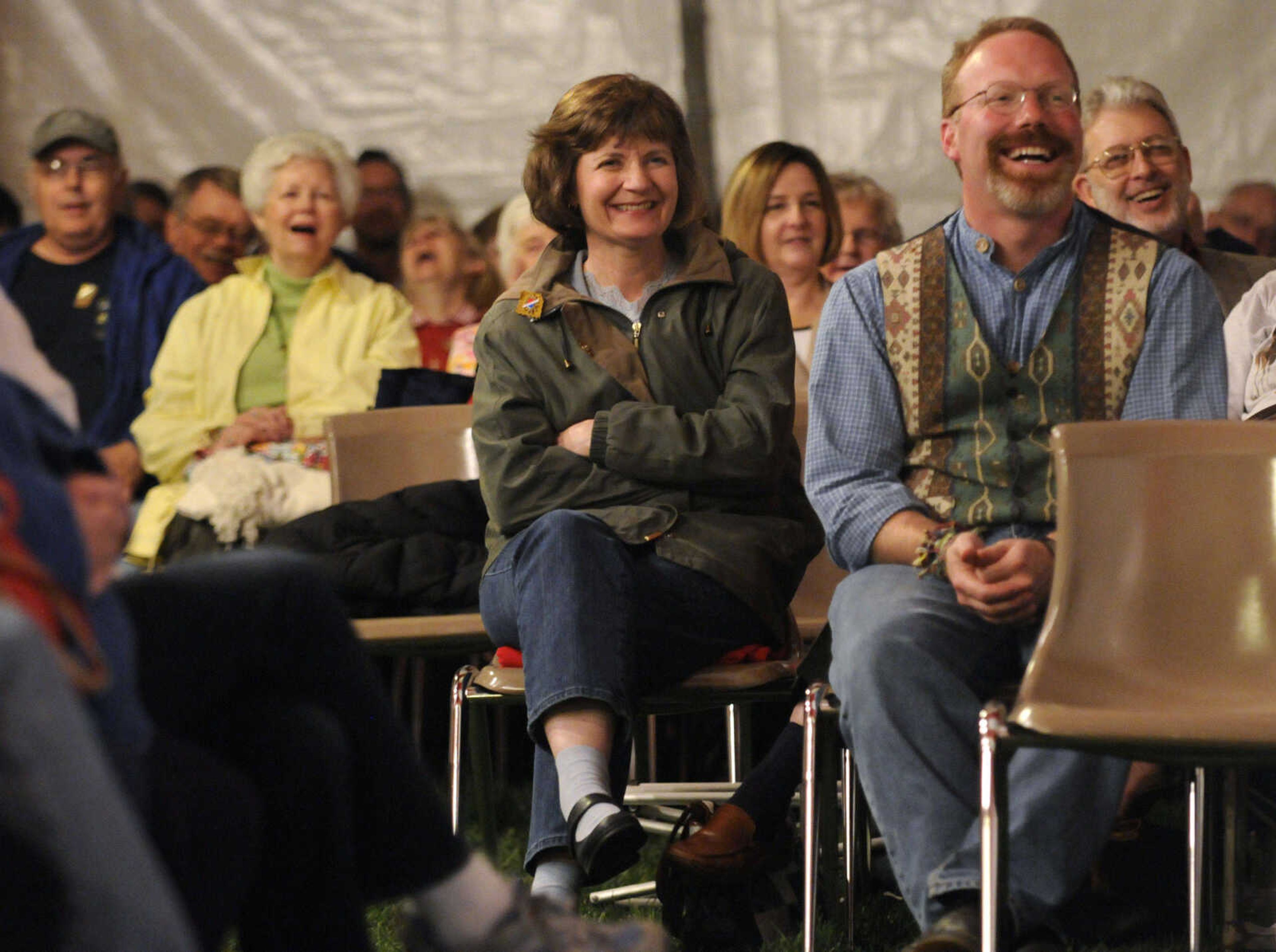 KRISTIN EBERTS ~ keberts@semissourian.com

Julie King, left, and Joel Rhodes, co-producer of the festival, laugh while listening to Syd Lieberman during the Storytelling Festival in Cape Girardeau, Mo., on Friday, April 9, 2010.