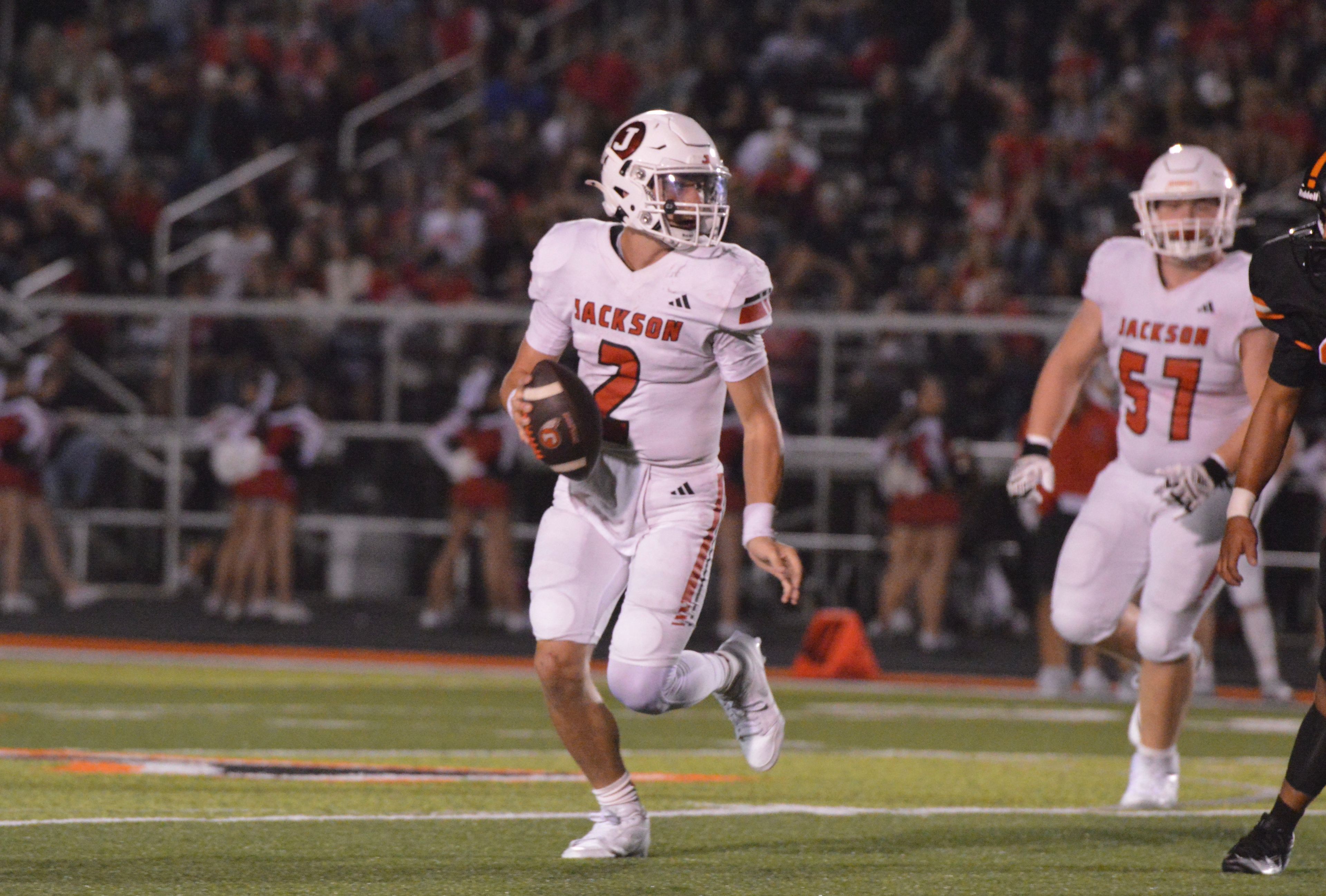 Jackson quarterback Drew Parsons scrambles out of the pocket and looks downfield against Cape Central on Friday, Oct. 4. Parsons finished the night with over 250 total yards as the Indians dominated the Tigers 42-6.