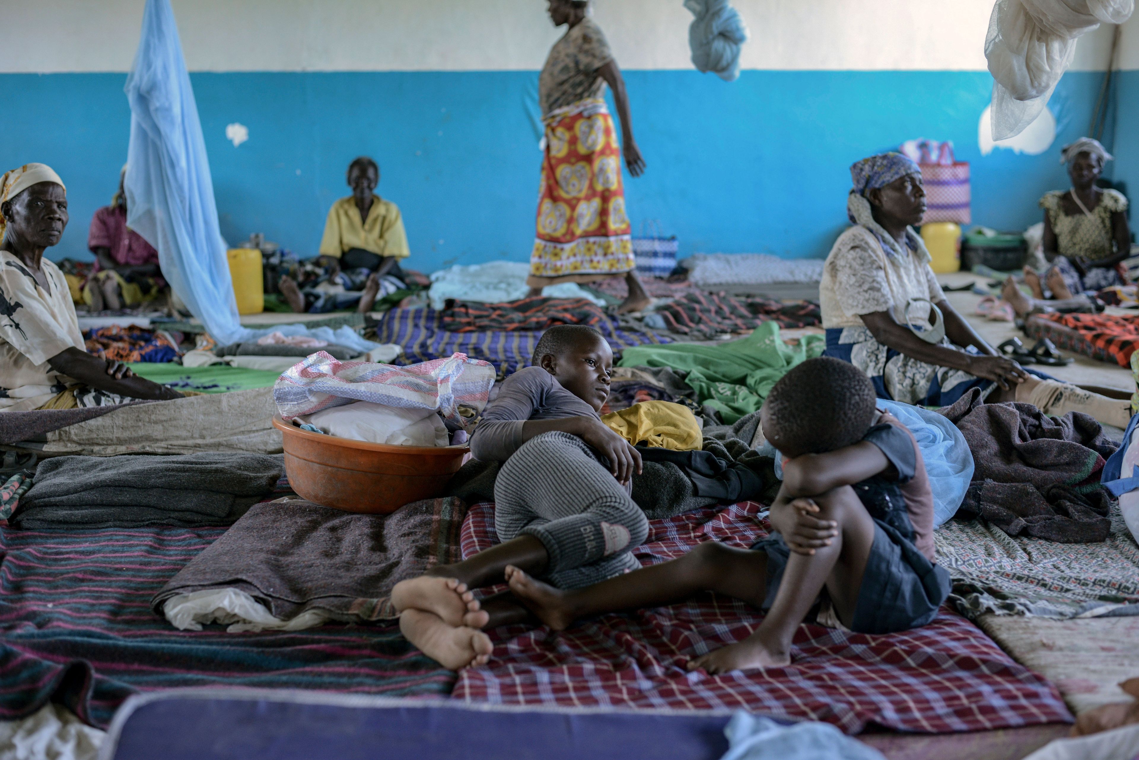 FILE - Residents take refugee at Ombaka Primary School after fleeing floodwaters that wreaked havoc in Ombaka Village, Kisumu, Kenya, April 17, 2024. (AP Photo/Brian Ongoro)