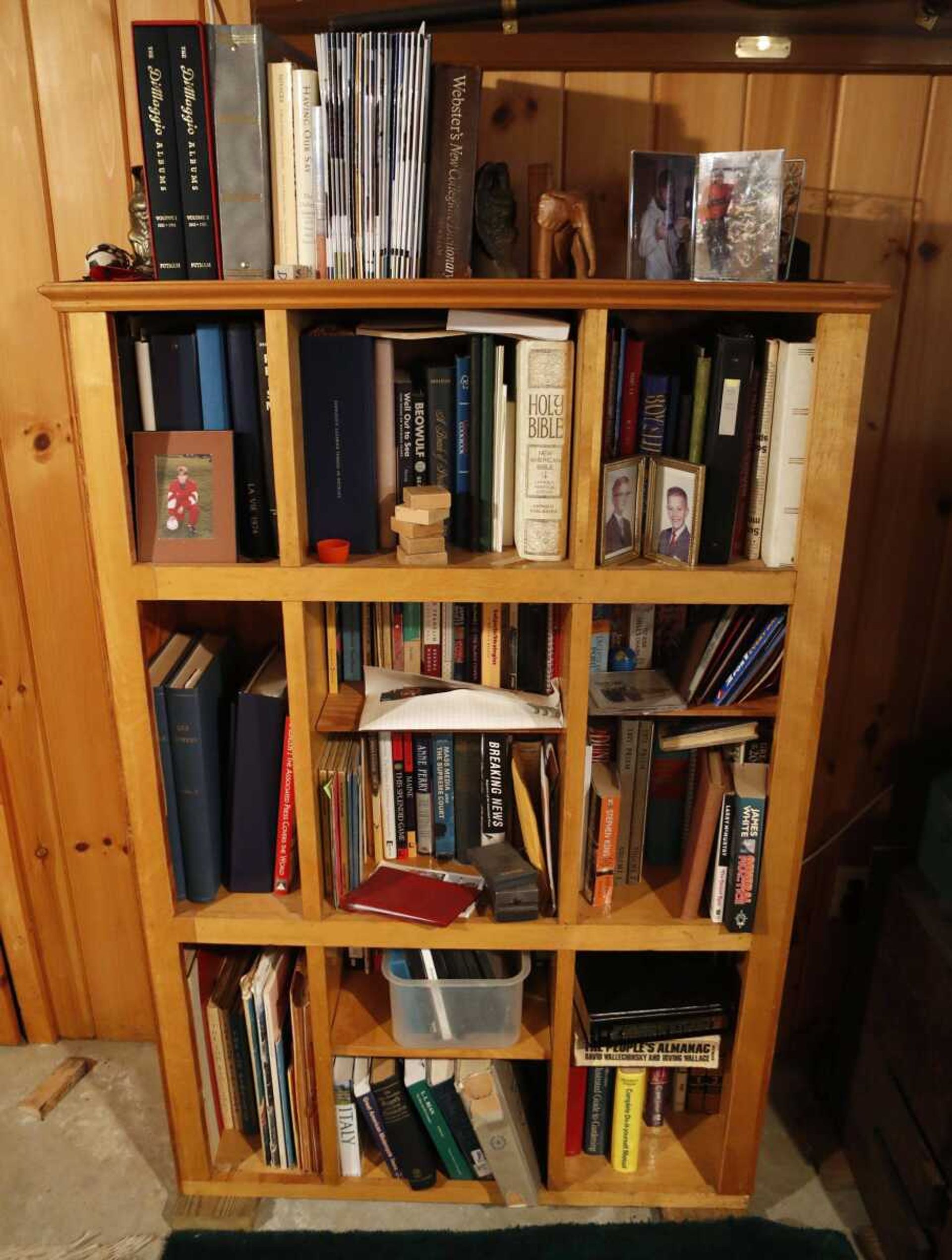 This Nov. 2 photo shows a discarded snack-bar counter which was converted into a bookshelf by Glenn Adams at his home in Augusta, Maine.