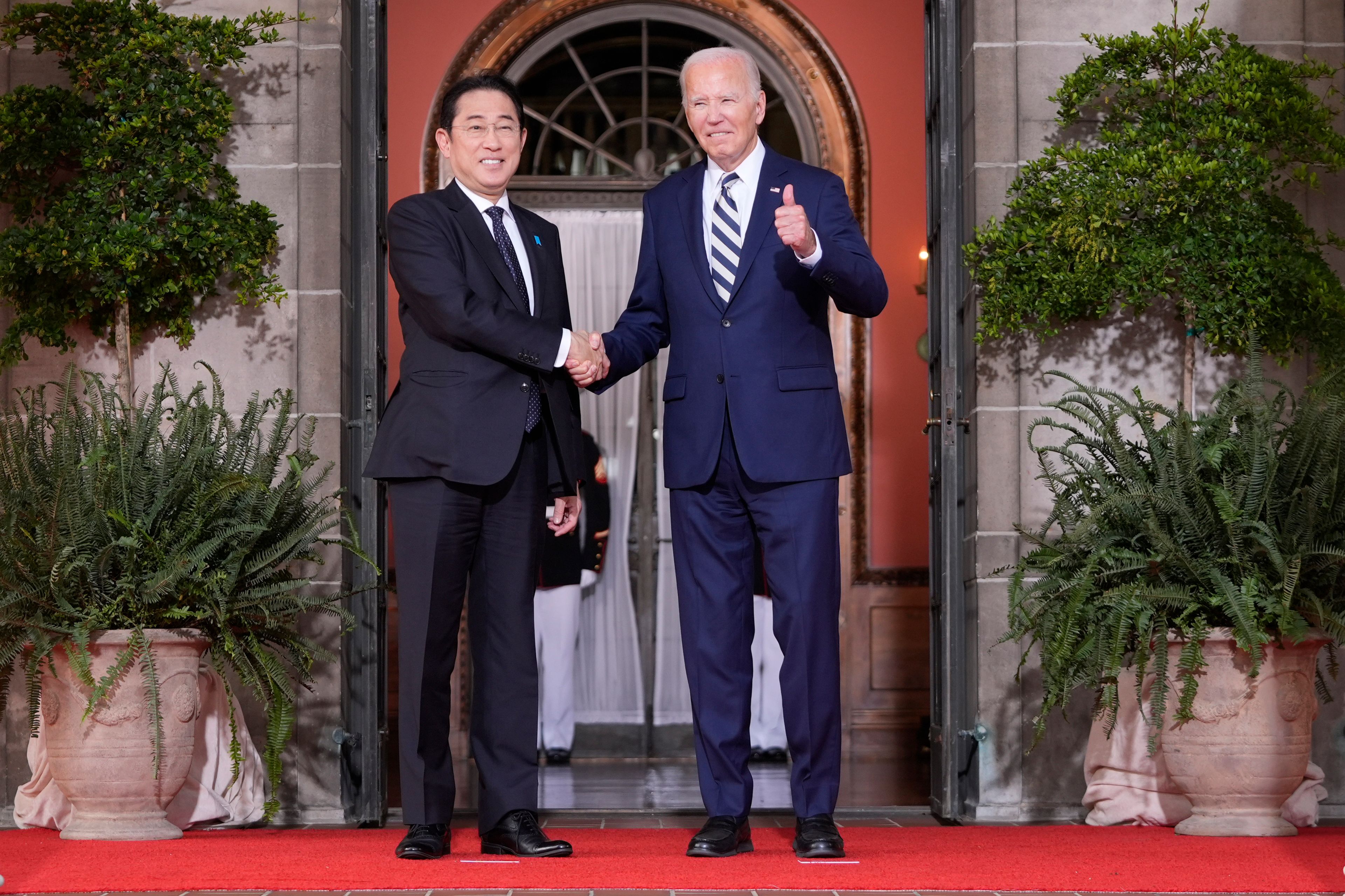 President Joe Biden greets Japan's Prime Minister Fumio Kishida at the Quad leaders summit at Archmere Academy in Claymont, Del., Saturday, Sept. 21, 2024. (AP Photo/Mark Schiefelbein)