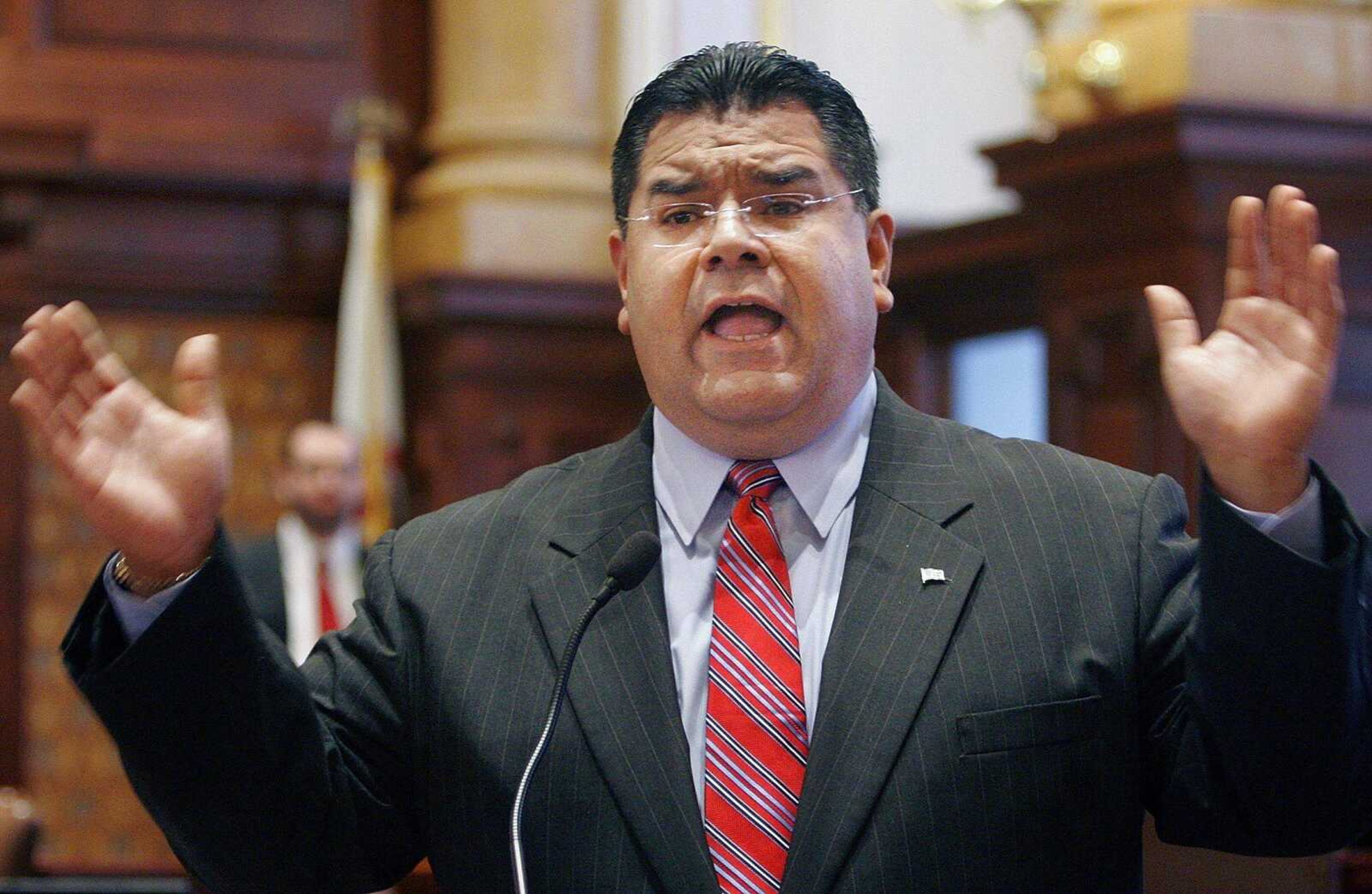 Illinois Sen. Martin Sandoval, D-Chicago, argues mass transit funding legislation and criticizes Illinois Gov. Rod Blagojevich while on the Senate floor during a session at the Illinois State Capitol in Springfield, Ill., Thursday, Jan. 17, 2008. (AP Photo/Seth Perlman)