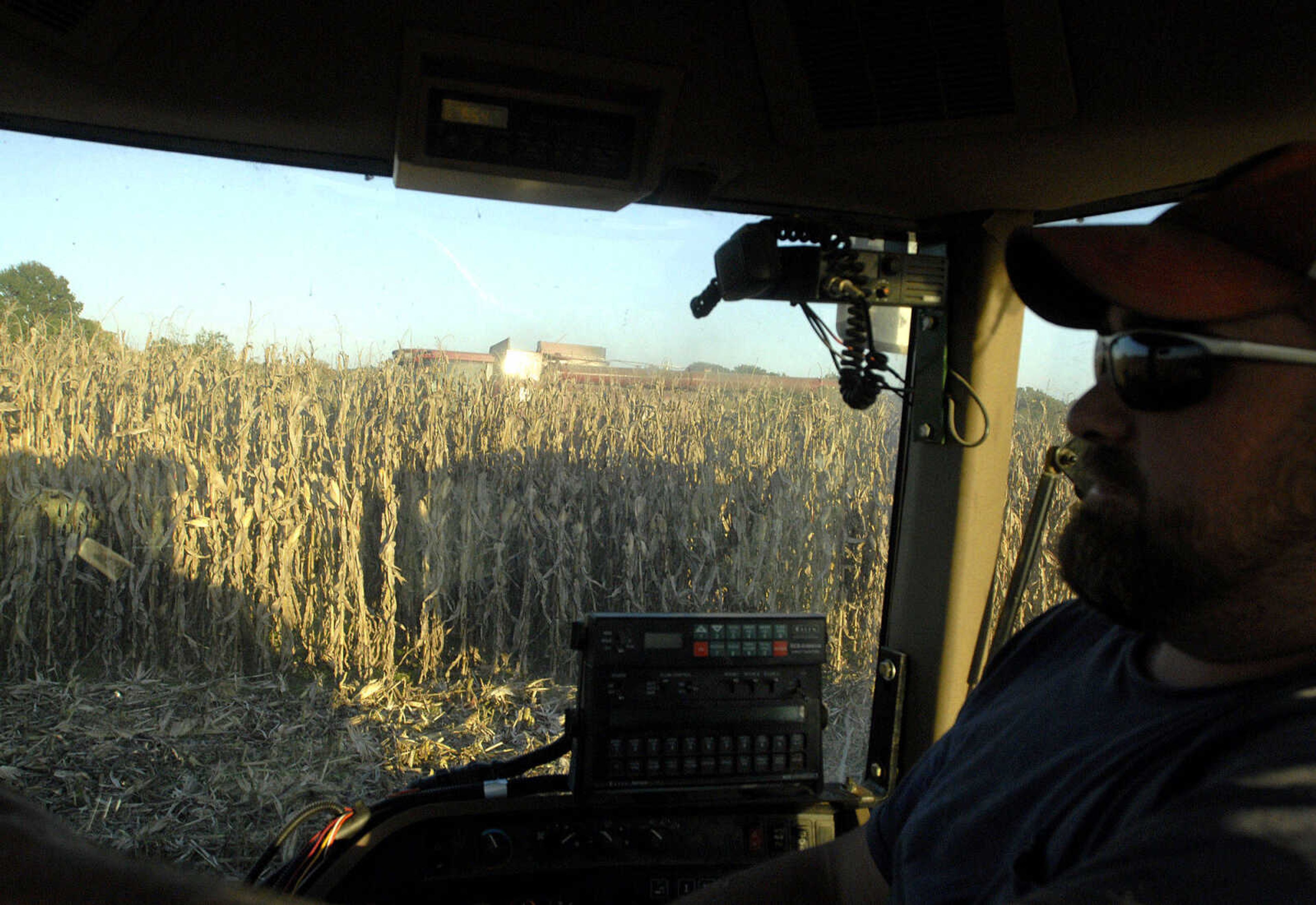 LAURA SIMON ~ lsimon@semissourian.com
Blane Milde rides parallel to his father Frank as they harvest corn Tuesday, October 4, 2011 near Jackson, Mo.