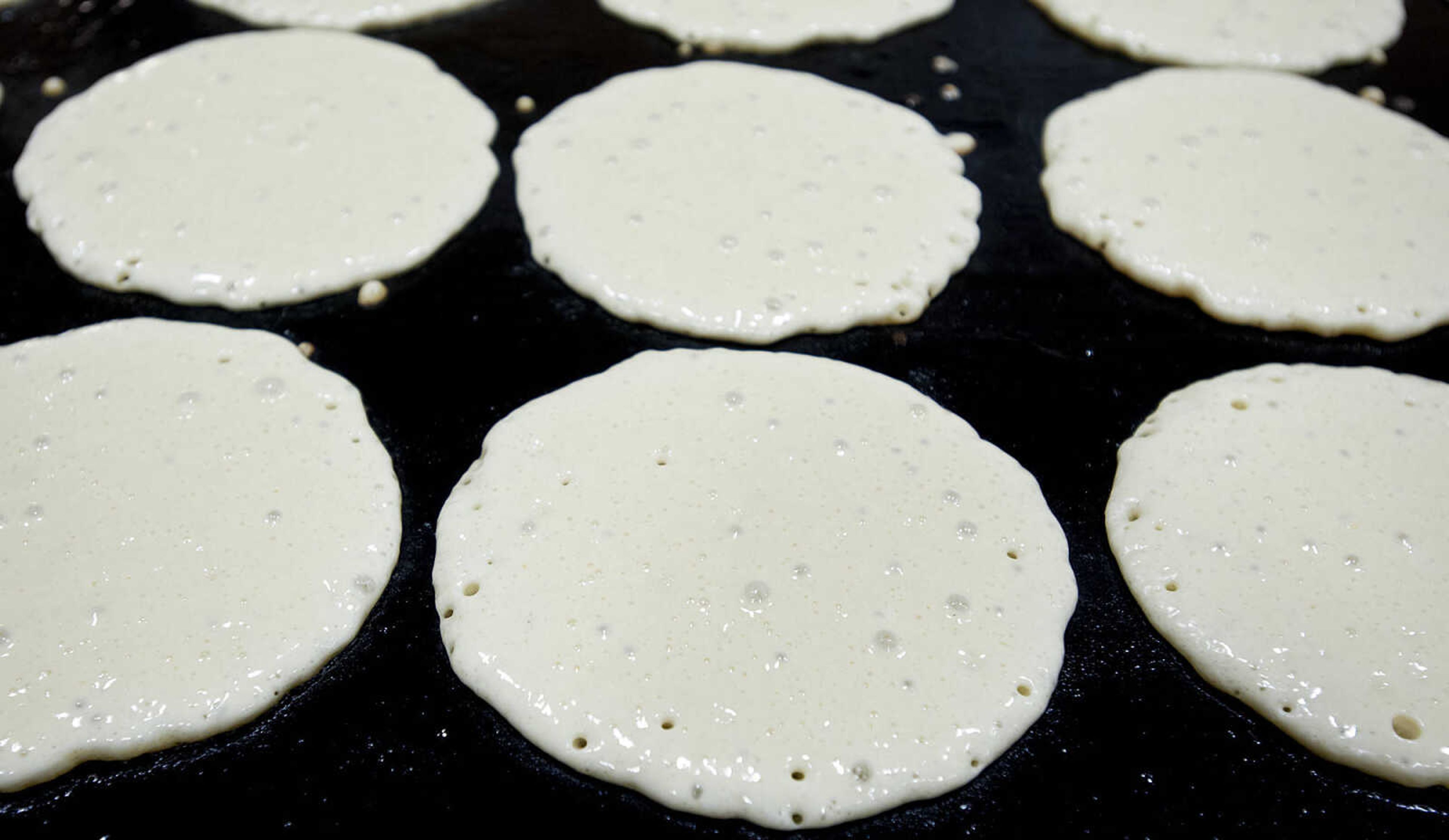 Pancakes cook on grills during the 76th Annual Noon Lions Club Pancake Day Wednesday, March 12, at the Arena Building in Cape Girardeau. The club makes enough pancake batter to serve up to 14,000 pancakes to over  3,000 people during the twelve hour event according to Robbie Guard, the General Chairman of the Pancake Committee. The longest continuously running pancake event in the United States, pancake day is the Noon Lions Club's principal fundraiser for the year.