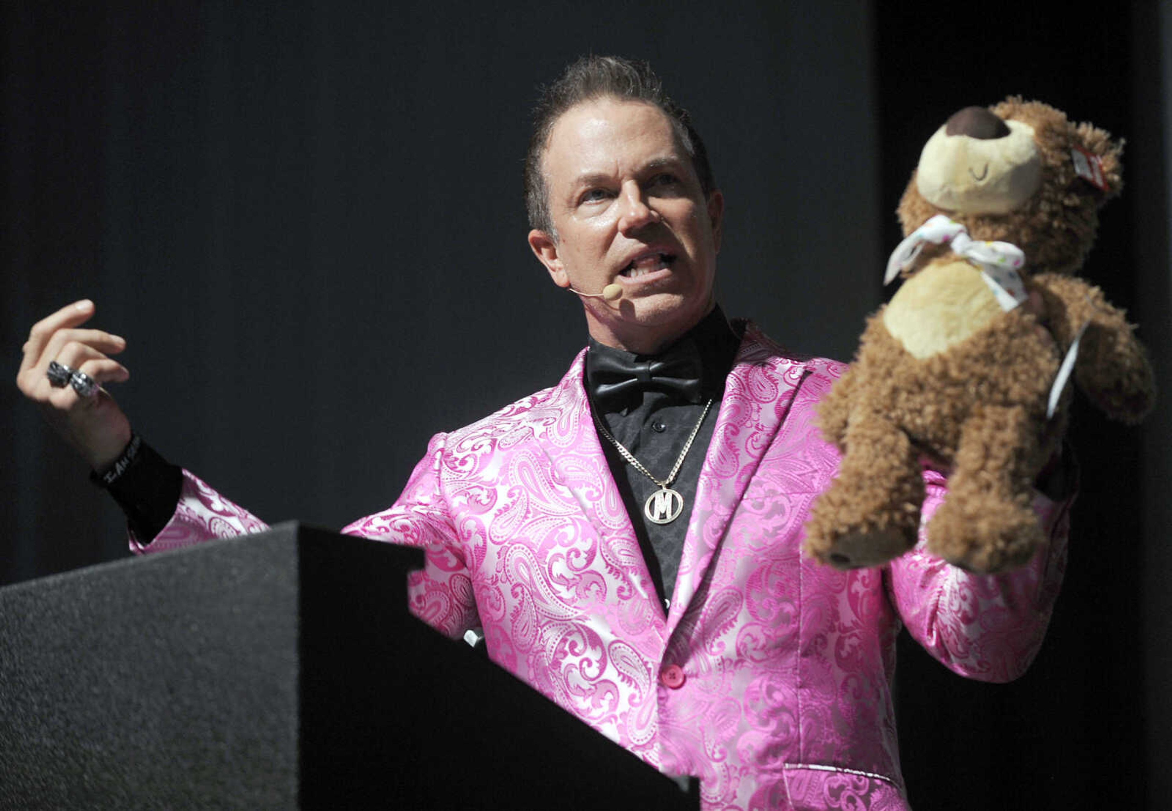 Marvelless Mark Kamp, master of ceremonies, talks about Ramone, the Prayer Bear, at the American Cancer Society Gala, "Destination Cure," Saturday, Sept. 23, 2017 at the Cape Girardeau Regional Airport.