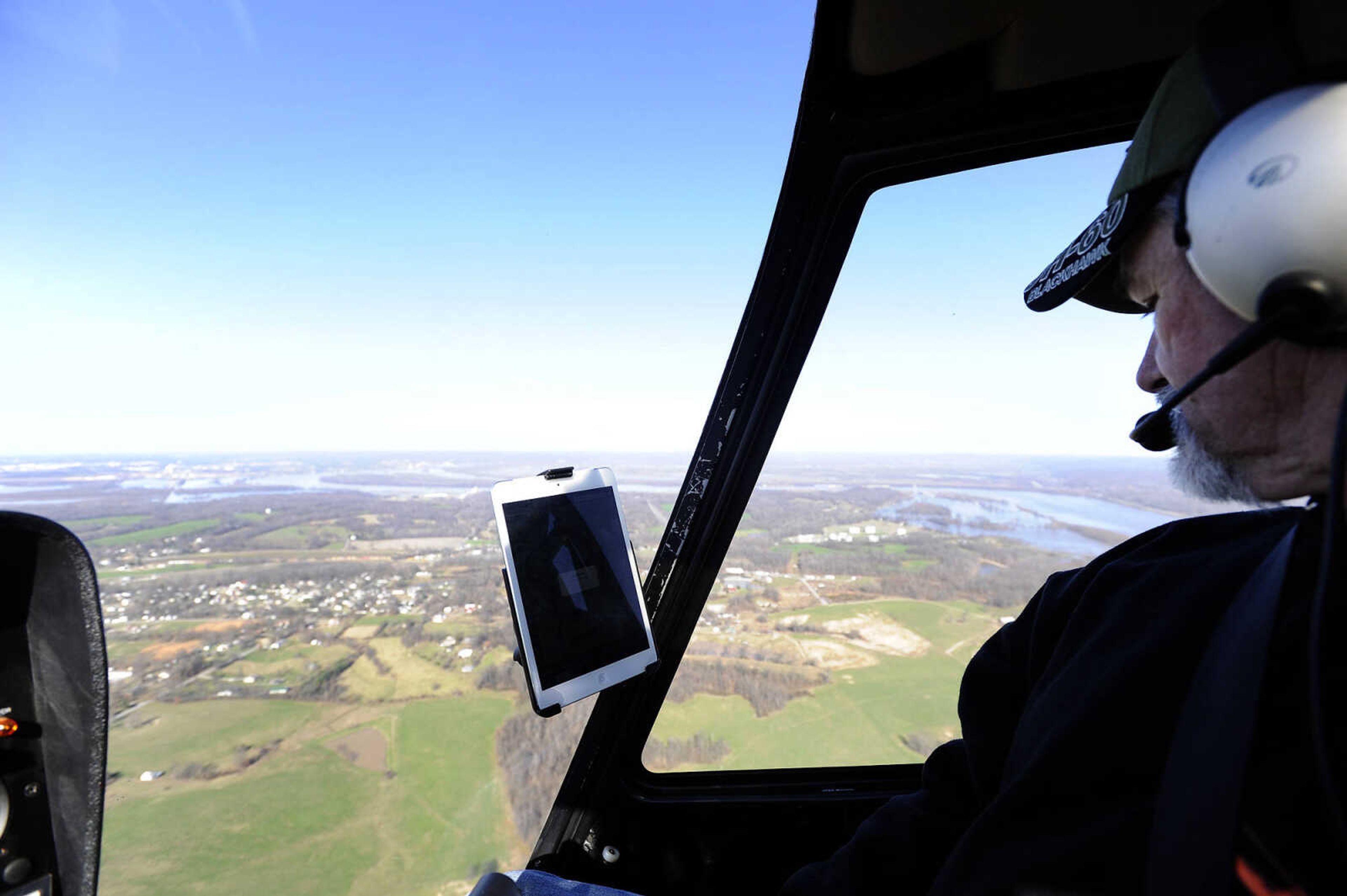 LAURA SIMON ~ lsimon@semissourian.com

Dean Houseman with Cape Copters flies over the flooded areas along the Mississippi River, Saturday, Jan. 2, 2016.