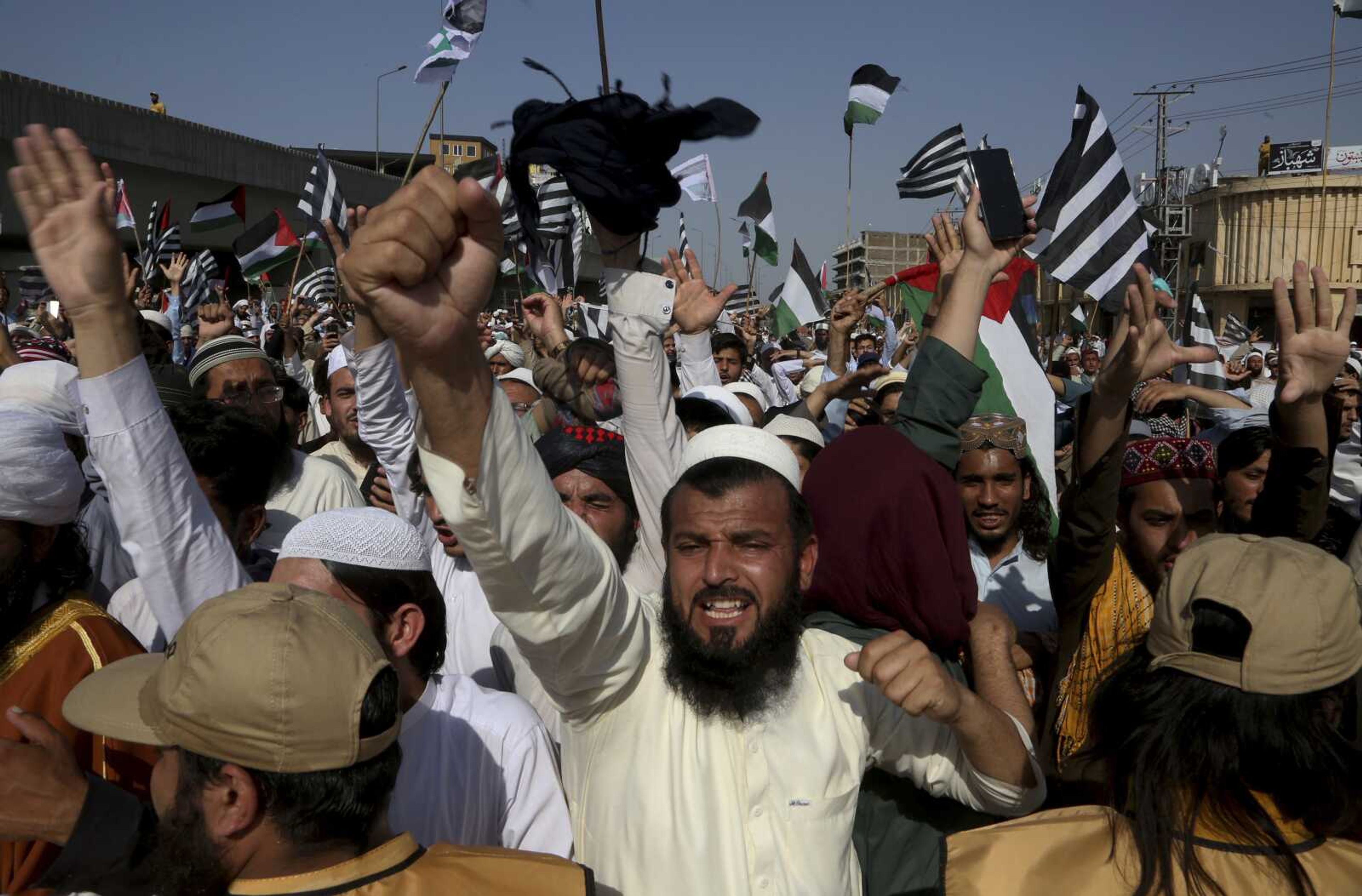 Supporters of the Pakistani religious group' Jamiat Ulema-e Islam chant slogans Friday during a rally in support of Palestinians, in Peshawar, Pakistan.