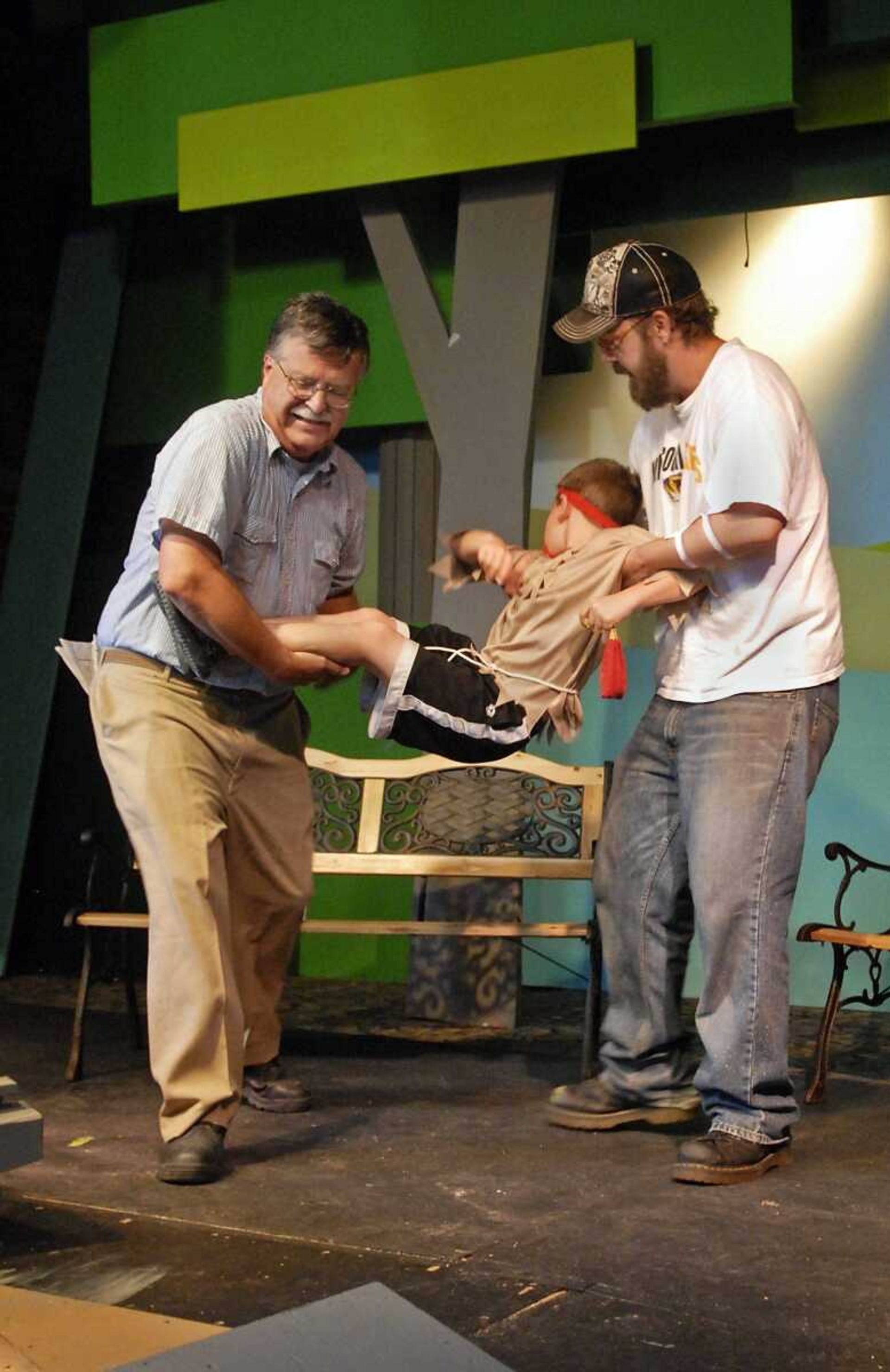 Sam, played by Mike Craig, left, and Bill, played by Aaron Allen, kidnap Red Chief, played by Tanner Smith, center, during a rehearsal for the River City Players' performance of "The Ransom of Red Chief" at Port Cape Girardeau on Tuesday, June 1, 2010. (KRISTIN EBERTS)