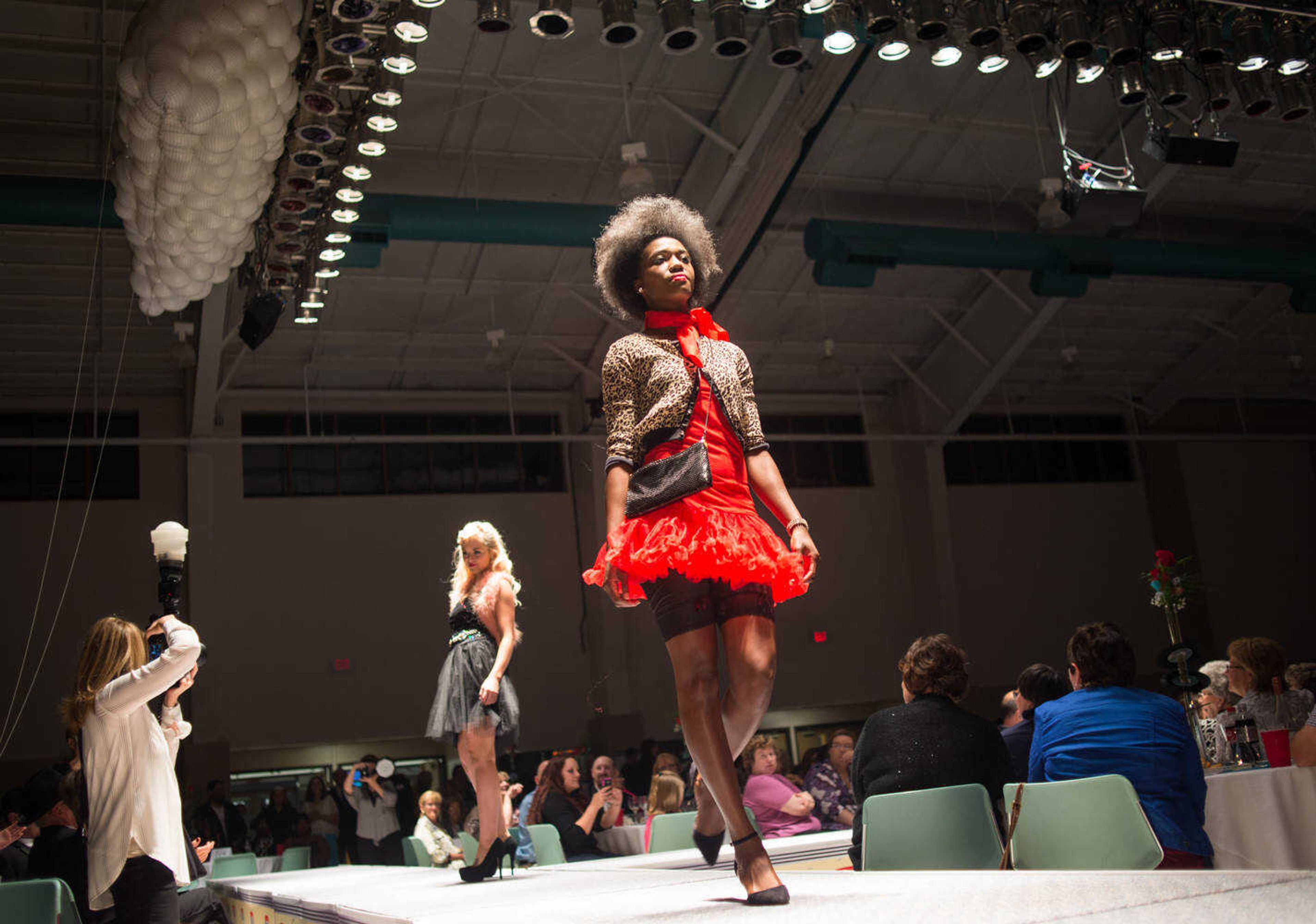 AARON EISENHAUER ~ photos@semissourian.com
Models walk the runway during the VintageNOW fashion show, a fundraiser for Safe House for Women, at the Osage Centre on Friday, October 17, 2014.