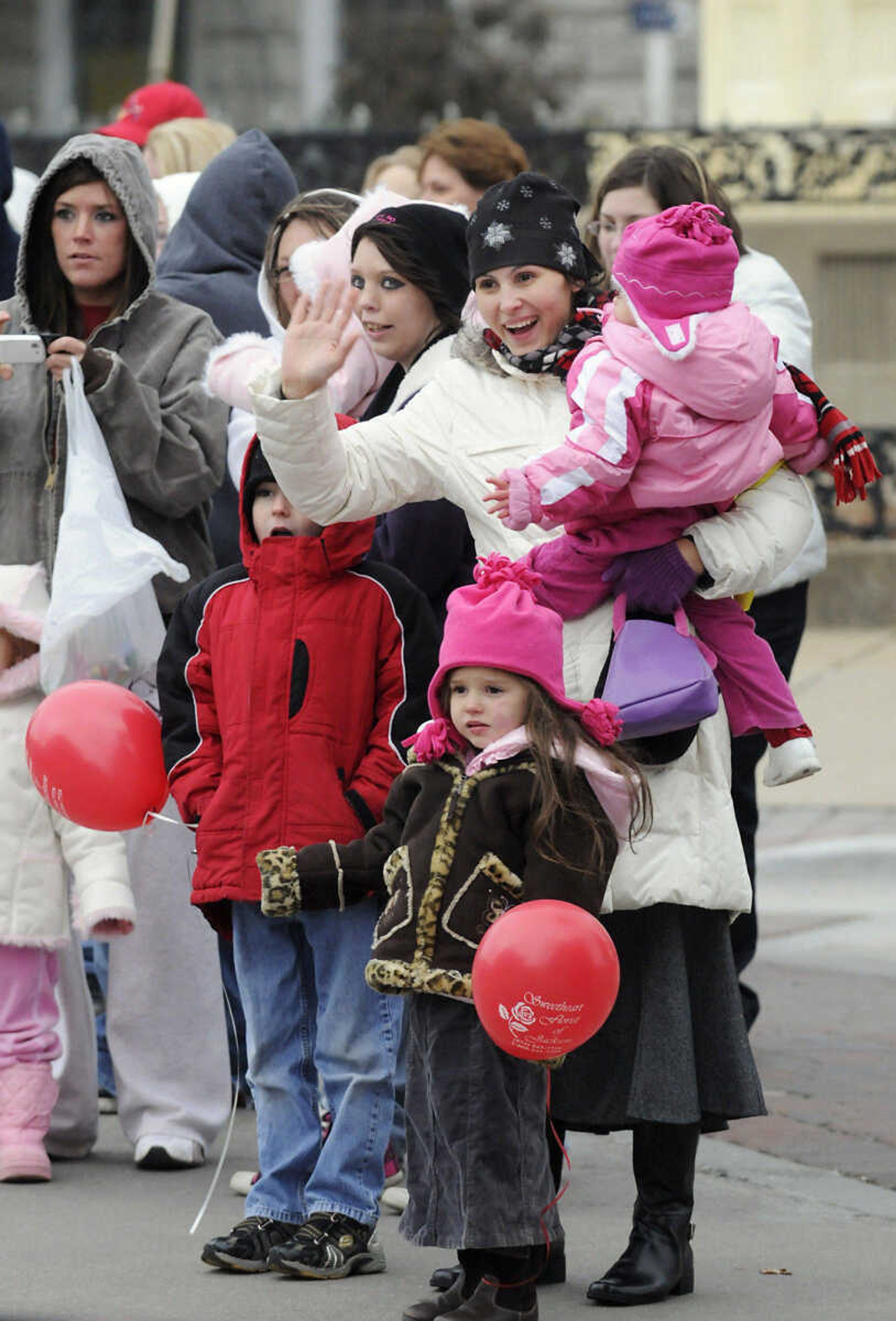 KRISTIN EBERTS ~ keberts@semissourian.com

Mariana French waves to floats with her kids Liliana, 2, Rosanna, 4, and Josiah, 7, from right, during the Jackson Christmas Parade on Saturday, Dec. 4, 2010, in downtown Jackson.