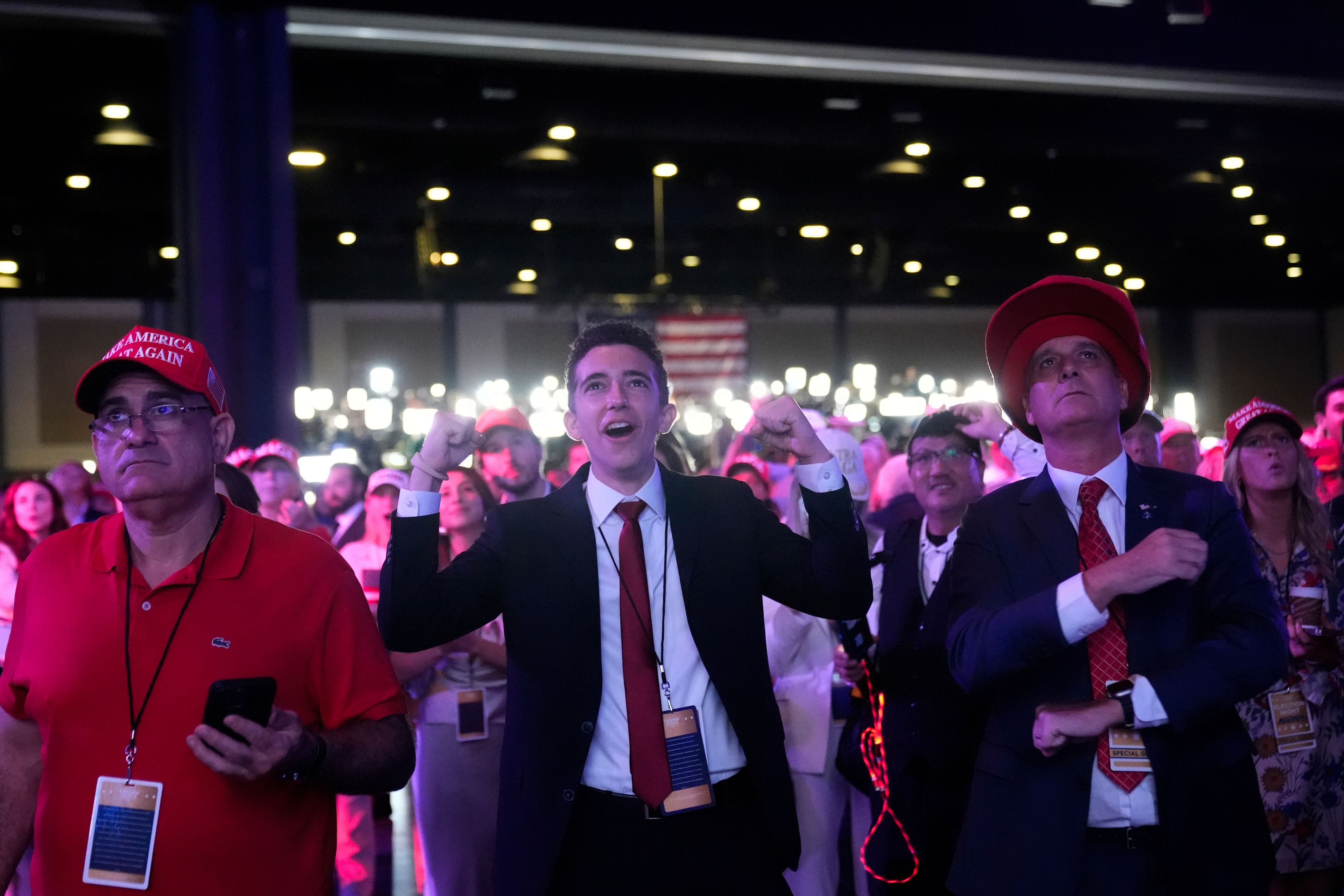 Supporters react as they watch election results at an election night campaign watch party for Republican presidential nominee former President Donald Trump Tuesday, Nov. 5, 2024, in West Palm Beach, Fla. (AP Photo/Alex Brandon)