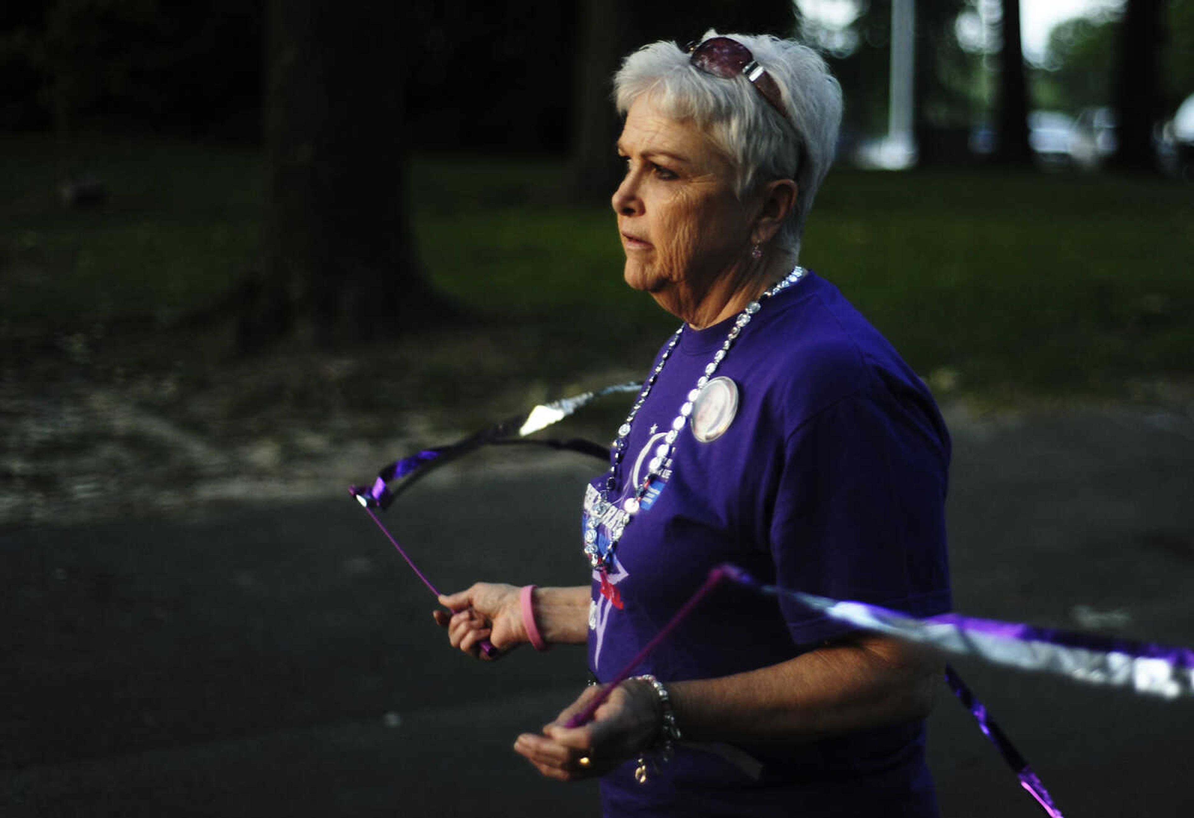 Sybil Whitworth, of Scott City, Mo., walks around the course during the Relay for Life of Cape Girardeau County, Friday, June 14, at Arena Park in Cape Girardeau. This is the 15th year for the event, which serves to raise awareness about cancer while also serving as a fundraiser for the American Cancer Society. Participants form teams which raise money before and during the event. Whitworth is a 16-year survivor of breast cancer.