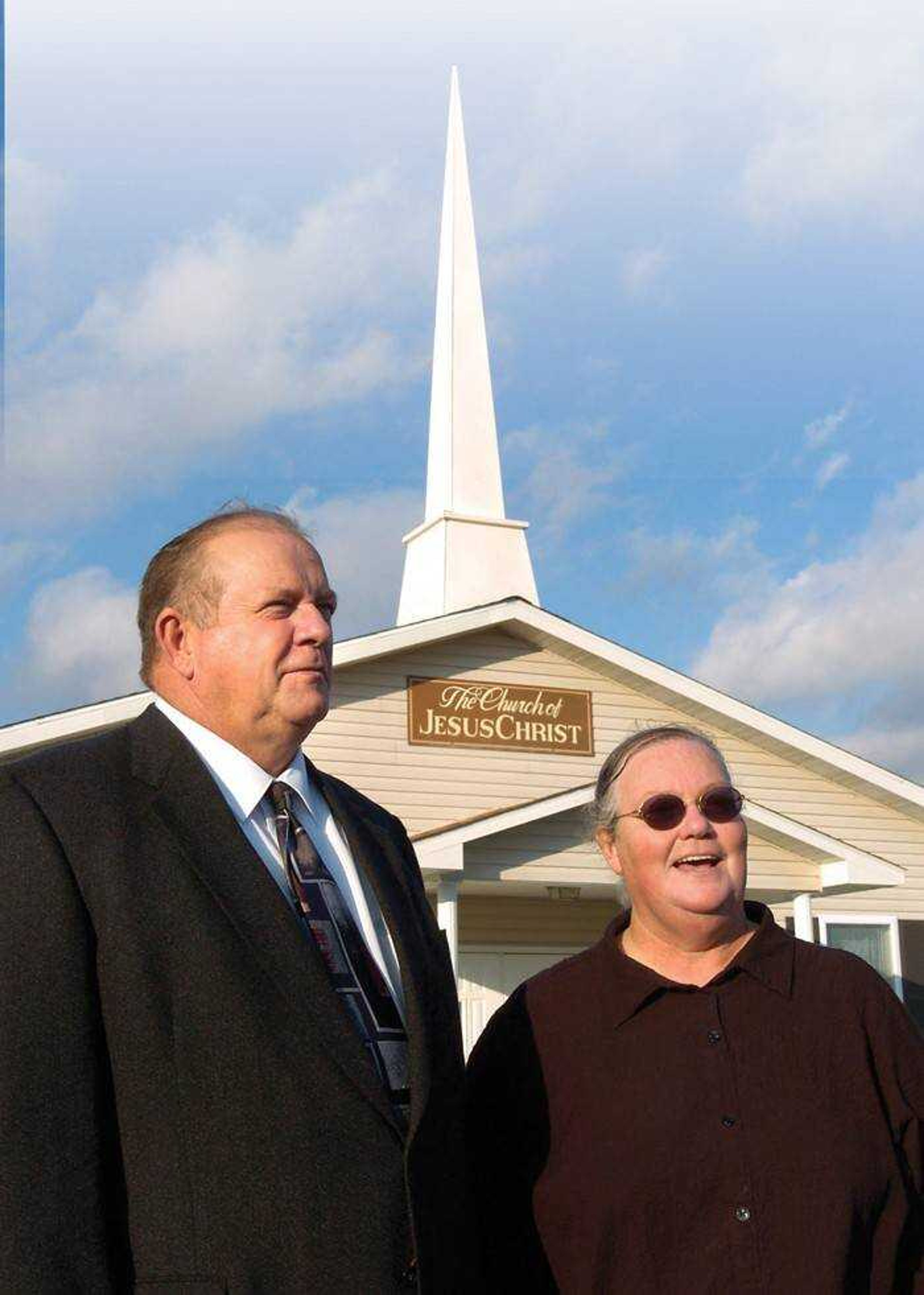 The Rev. Delbert Mueller and his wife, Jackie, stood in front of their rural church, off County Road 316 between Jackson and Gordonville. The church now has a steeple that she bought on eBay for 99 cents. (Fred Lynch)