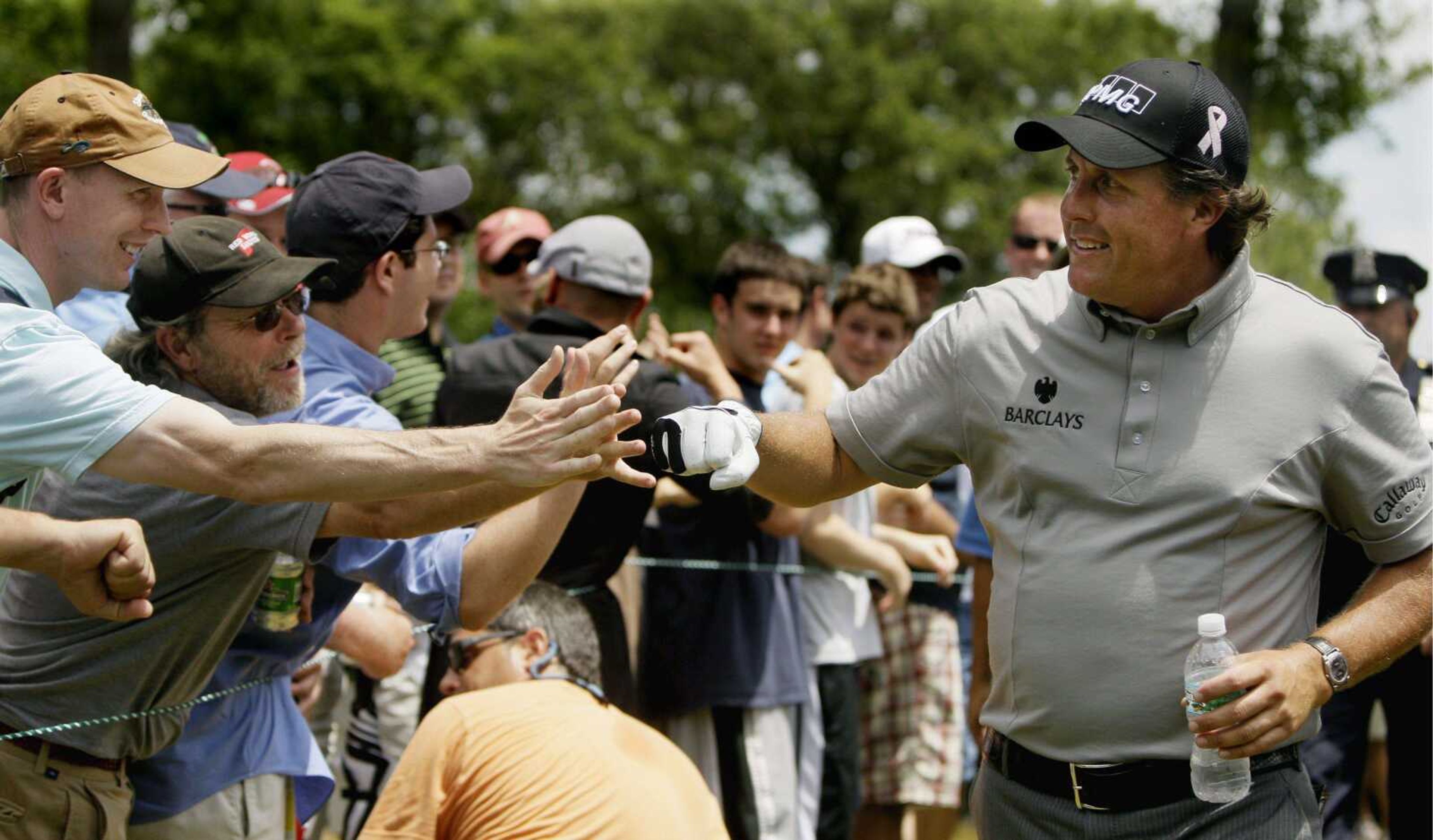 Phil Mickelson is greeted by fans as he walks to the 16th tee during the first round of the U.S. Open. (MATT SLOCUM ~ Associated Press)