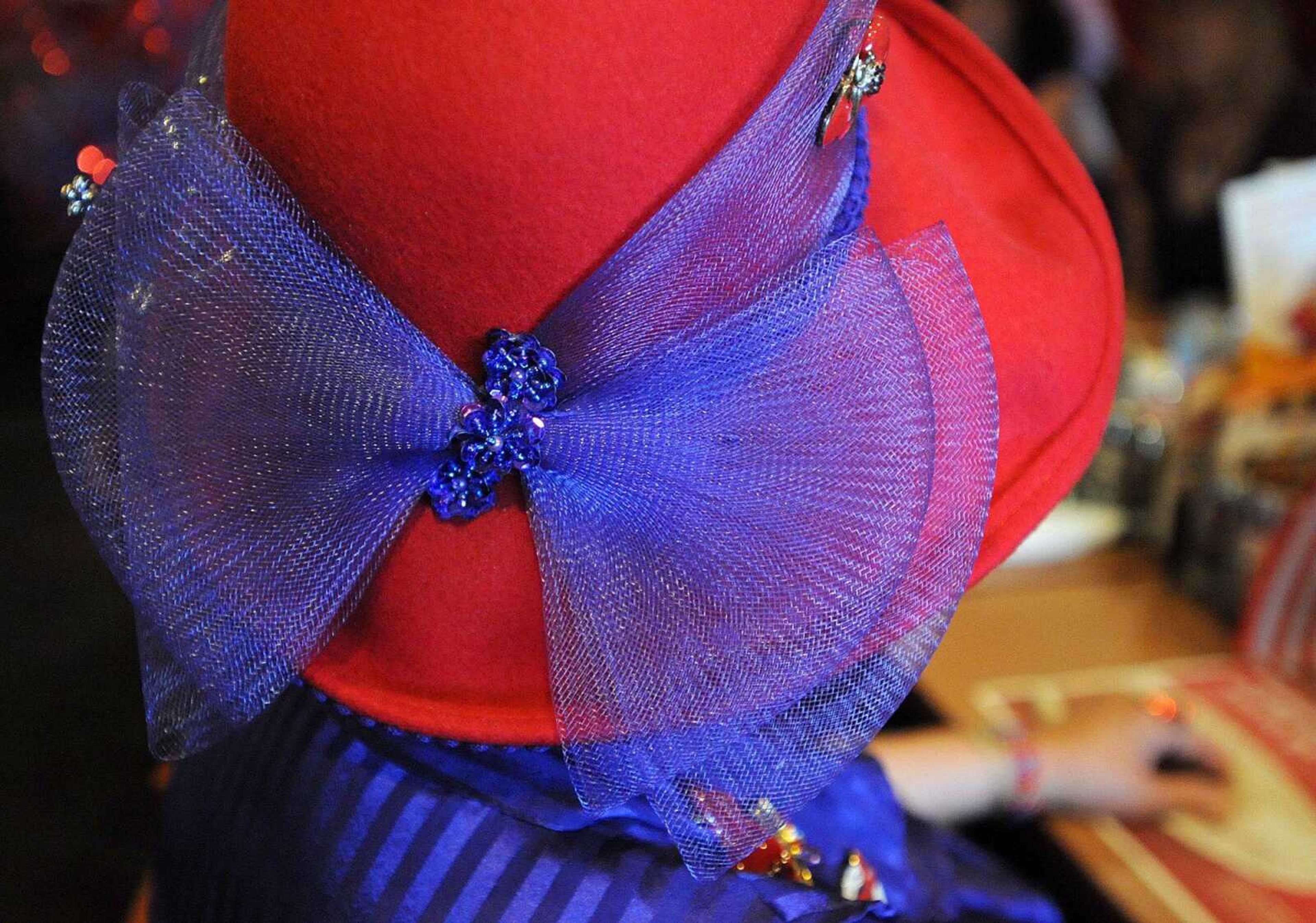 A red hat is a must at Classy Sassy Chicks chapter of the Red Hat Society. (Laura Simon)