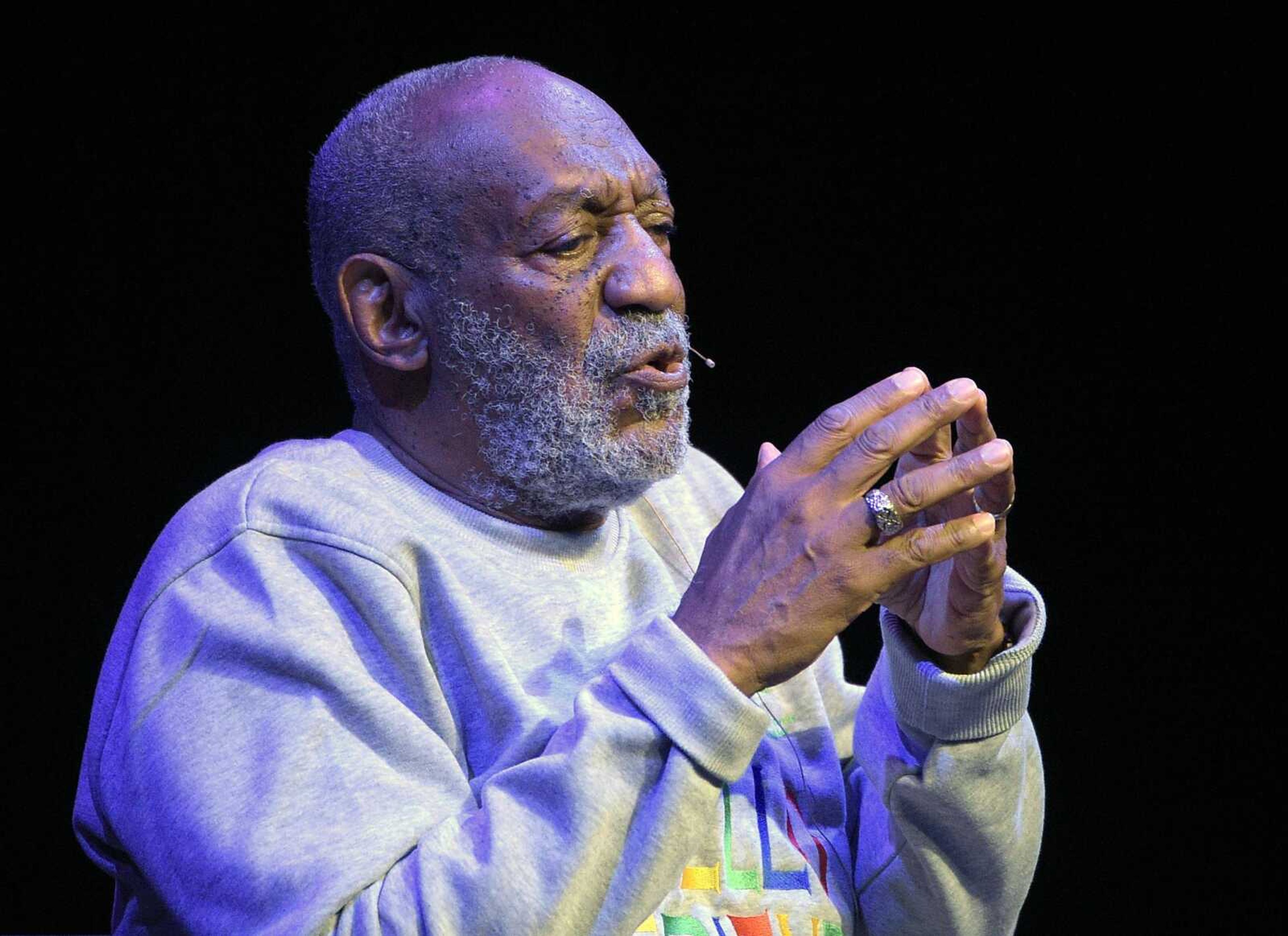 Comedian Bill Cosby performs during a show Friday at the Maxwell C. King Center for the Performing Arts in Melbourne, Florida. Performances by Cosby in Nevada, Illinois, Arizona, South Carolina and Washington state have been canceled as more women come forward accusing the entertainer of sexually assaulting them years ago. (Phelan M. Ebenhack ~ Associated Press)