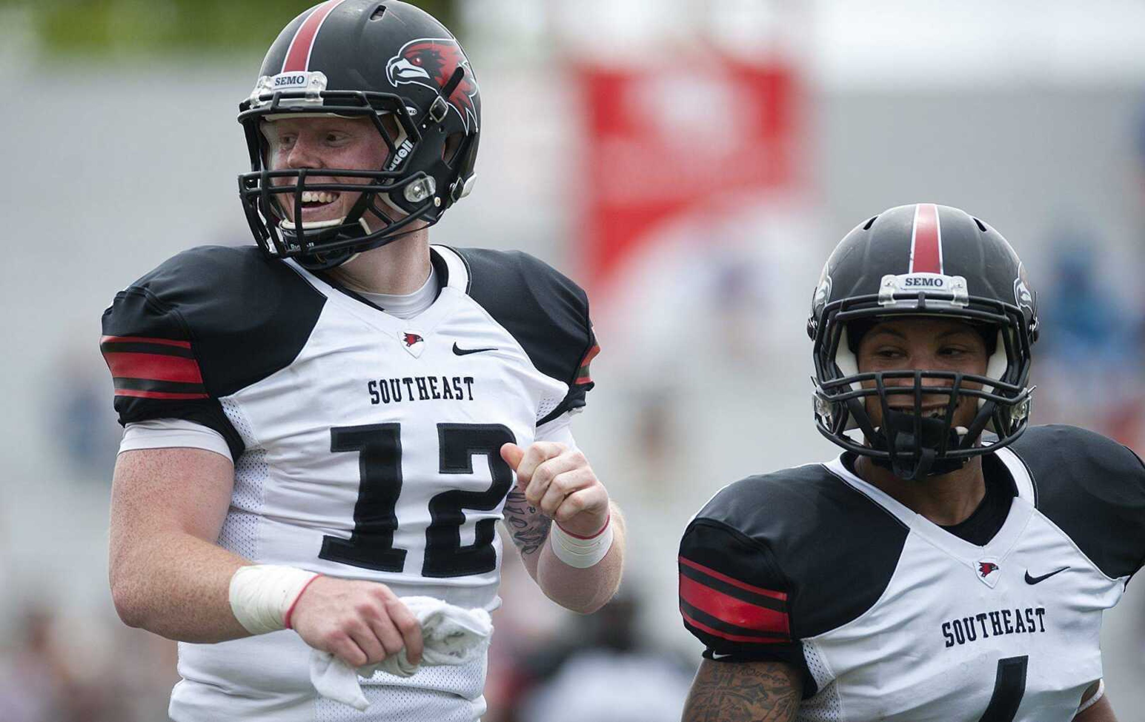 White Team quarterback Kyle Snyder, left, and White Team wide receiver Spencer Davis jog to the sideline after Snyder threw a 66-yard touchdown pass to wide receiver Tyler Manne in the second quarter of White's 28-0 win over the Red Team in the Southeast Missouri State University's 2014 Spring Game Saturday, April 26, at Houck Stadium. Snyder completed seven passes on ten attempts and rushed for 33 yards and two touchdowns. (Adam Vogler)