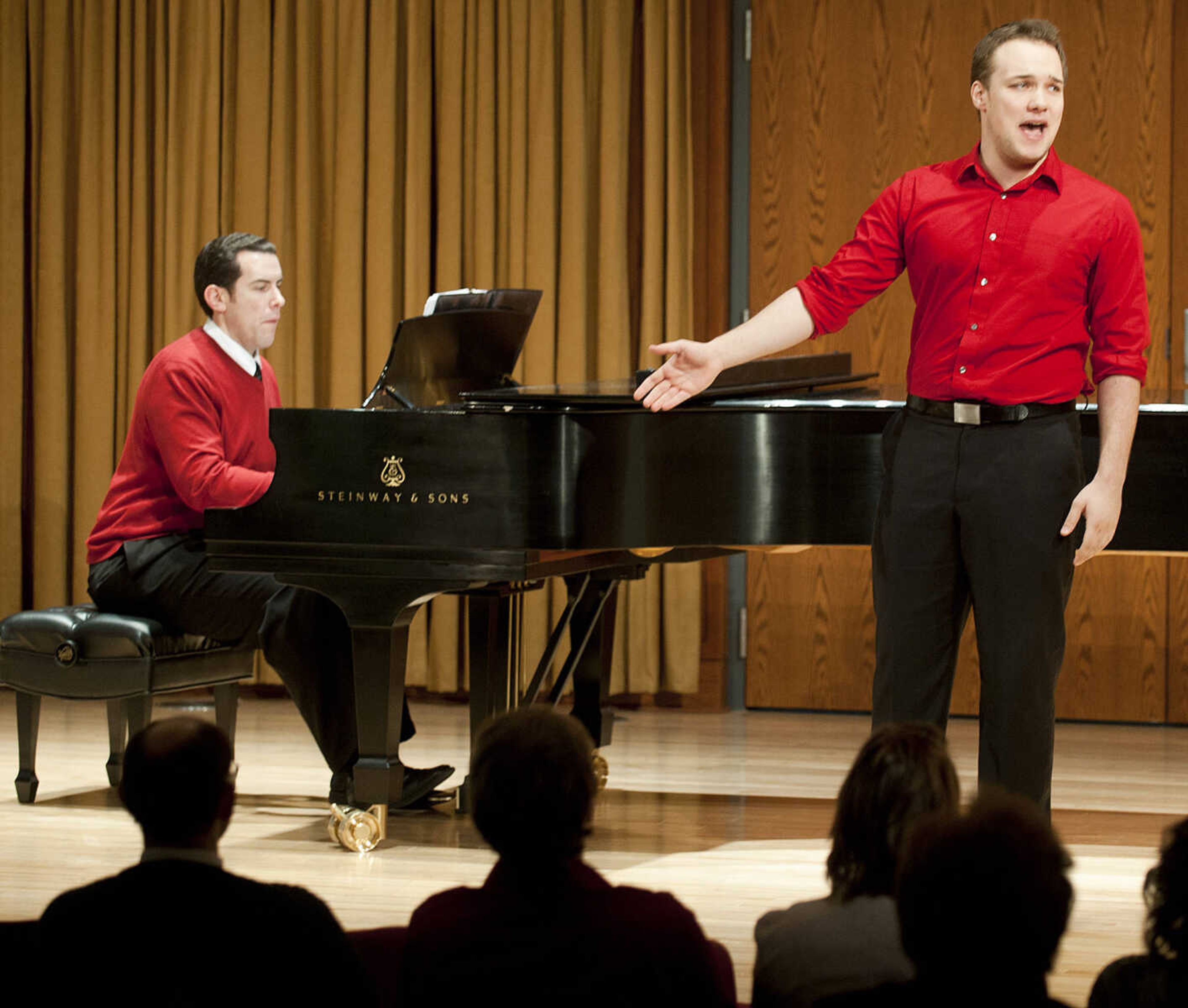 Southeast Missouri State University student Michael Burrell, right, is accompanied on piano by musical theatre instructor Joe Mason as he sings "Why, God, Why?" from the musical "Miss Saigon," during the Class Voice III Recital Sunday, Dec. 15, at the Shuck Recital Hall. Fifteen Southeast students performed during the annual recital which is in its sixth year.