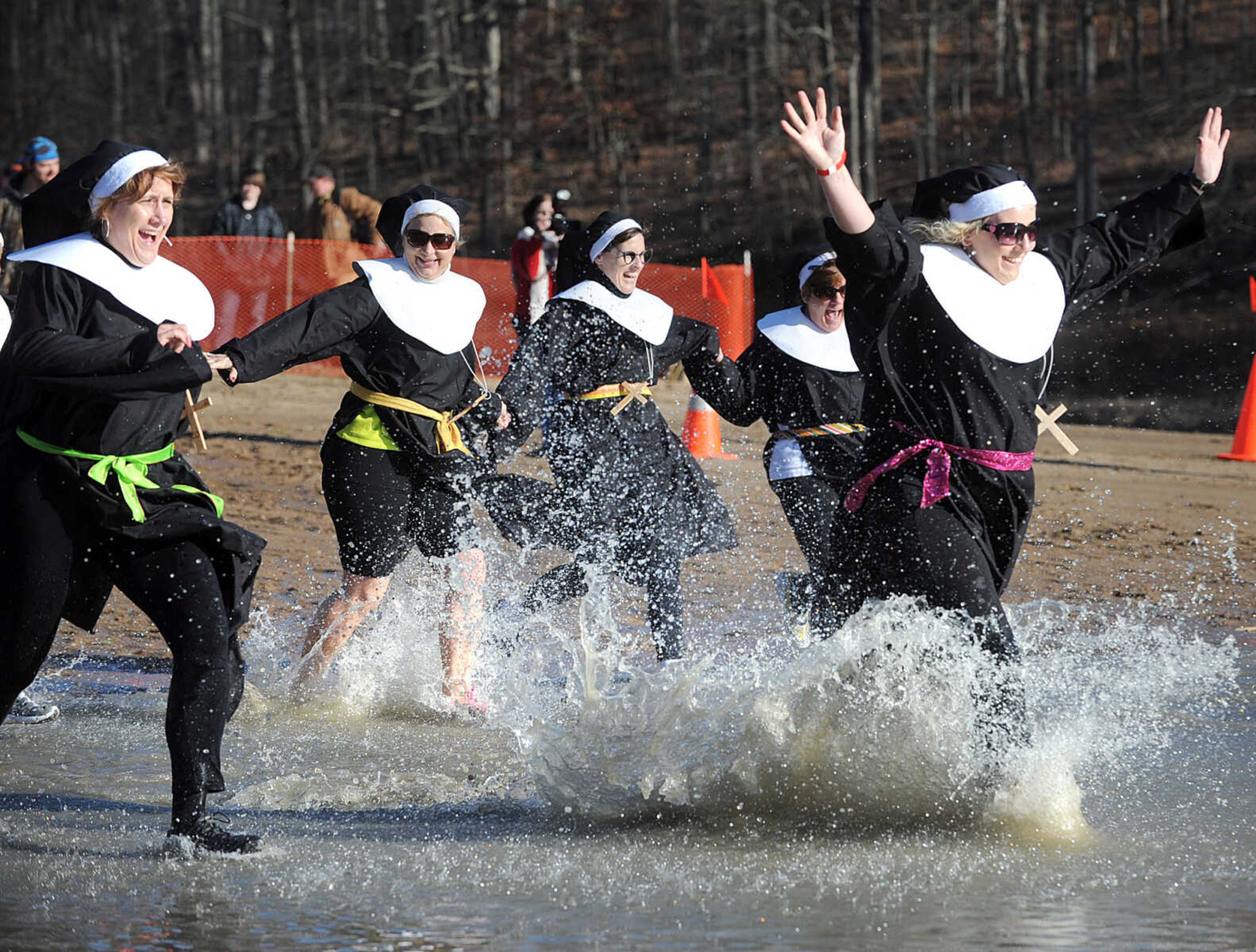 LAURA SIMON ~ lsimon@semissourian.com
People plunge into the cold waters of Lake Boutin Saturday afternoon, Feb. 2, 2013 during the Polar Plunge at Trail of Tears State Park. Thirty-six teams totaling 291 people took the annual plunge that benefits Special Olympics Missouri.