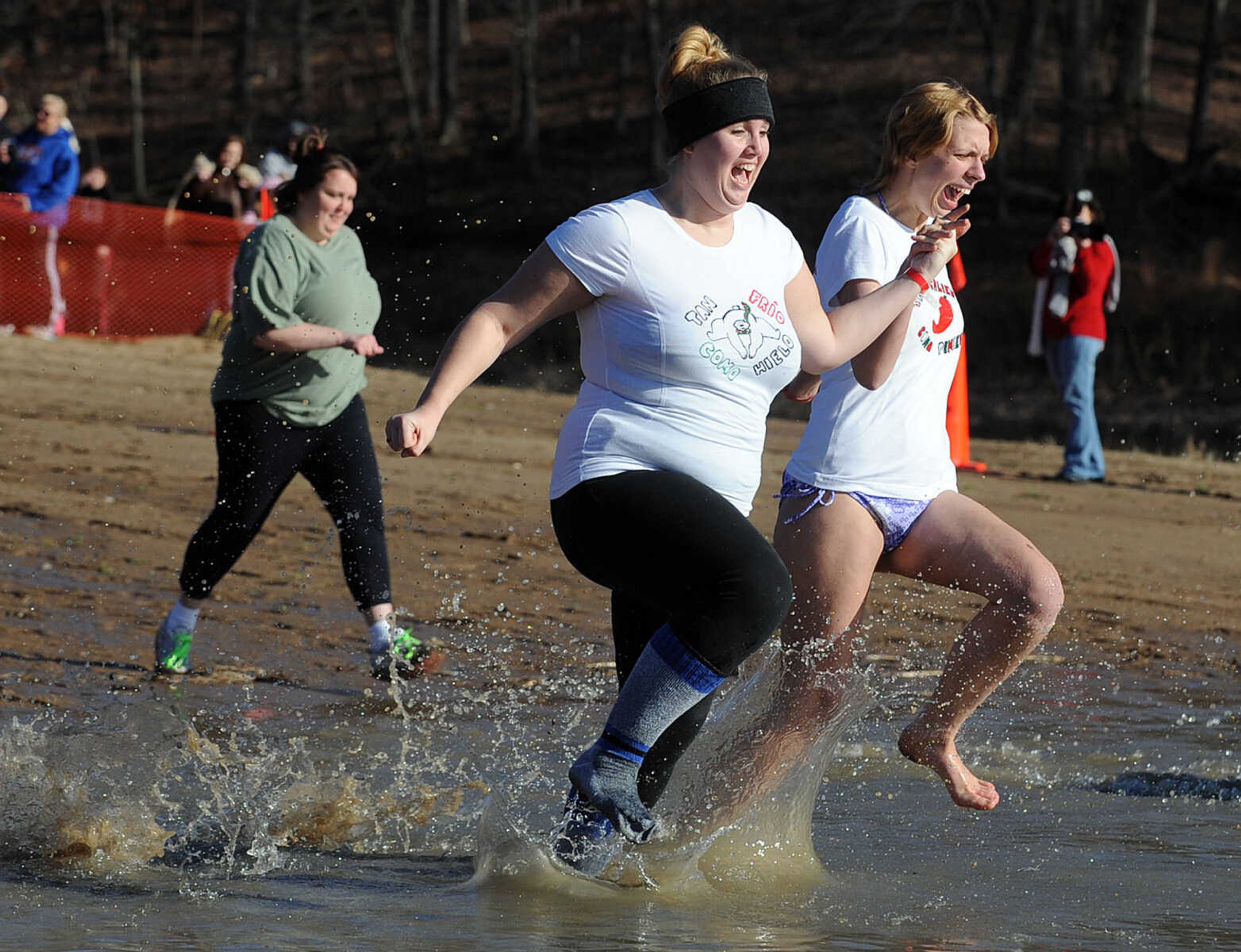 LAURA SIMON ~ lsimon@semissourian.com
People plunge into the cold waters of Lake Boutin Saturday afternoon, Feb. 2, 2013 during the Polar Plunge at Trail of Tears State Park. Thirty-six teams totaling 291 people took the annual plunge that benefits Special Olympics Missouri.