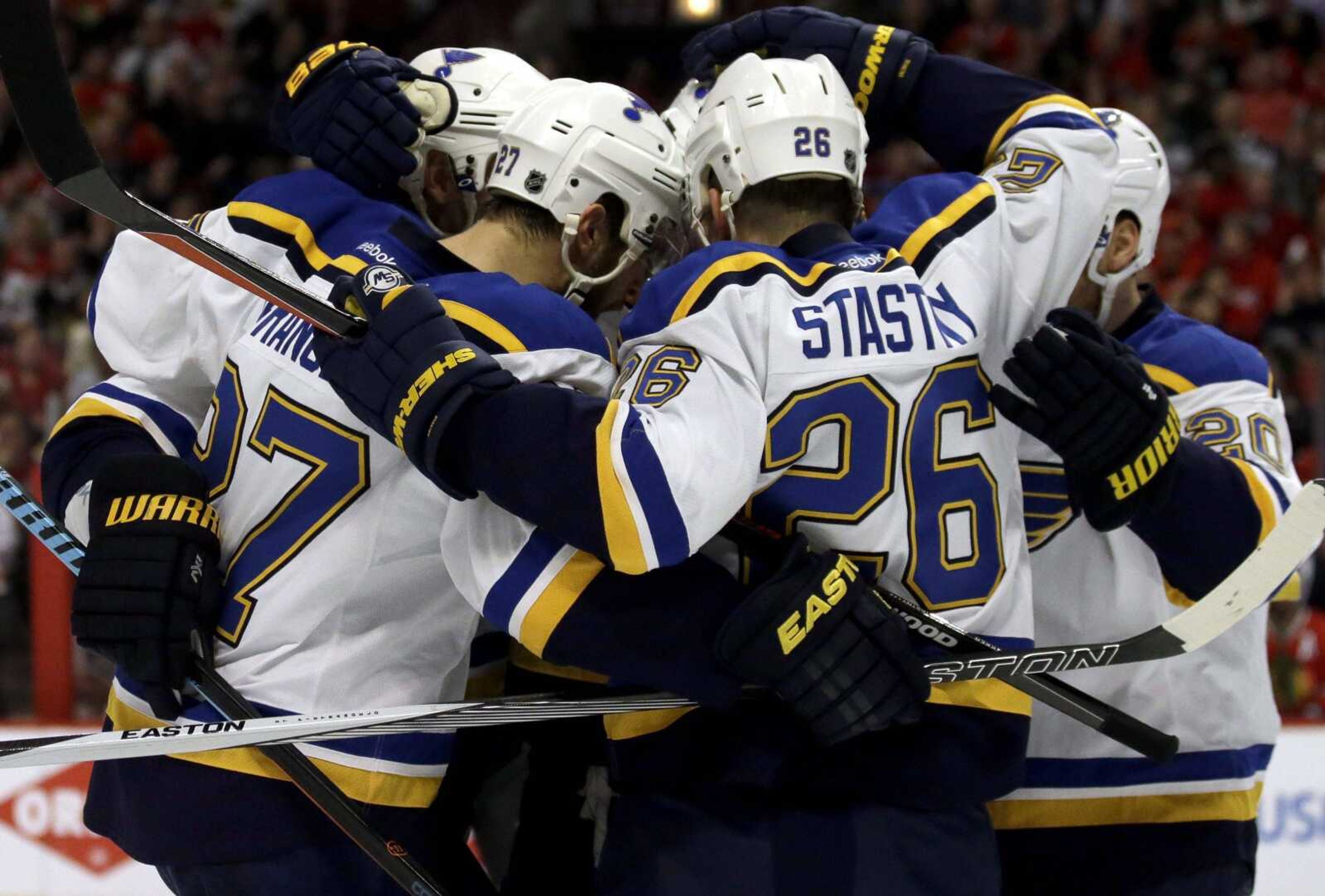 St. Louis Blues defenseman Alex Pietrangelo (27) celebrates with teammates after scoring a goal during the first period in Game 6 of an NHL hockey first-round Stanley Cup playoff series against the Chicago Blackhawks, Saturday, April 23, 2016, in Chicago. (AP Photo/Nam Y. Huh)