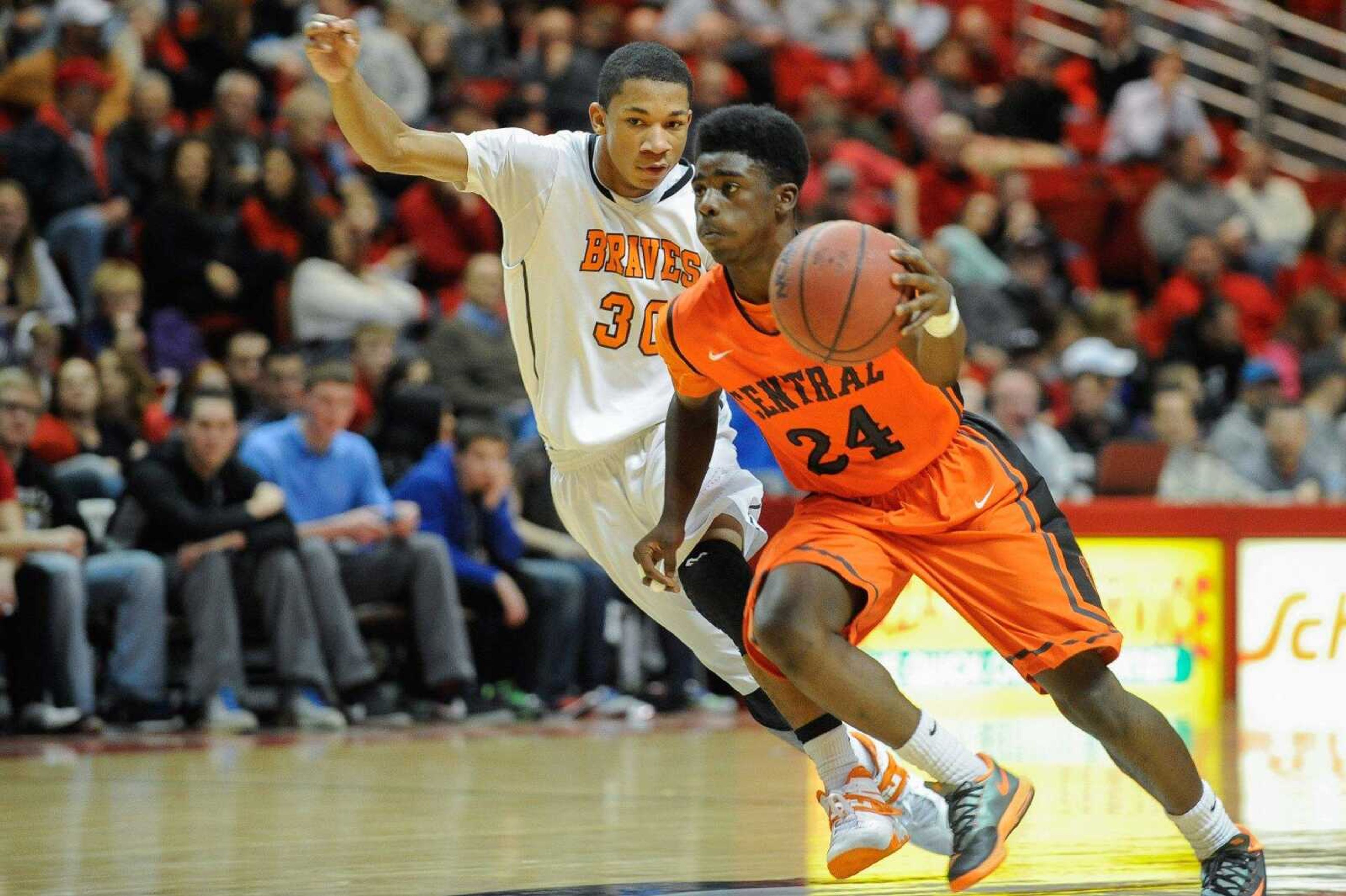 Cape Central's Kway'chon Chisom drives past Scott County Central's Matt Blissett during Tuesday's third-place game at the Show Me Center. (Glenn Landberg)