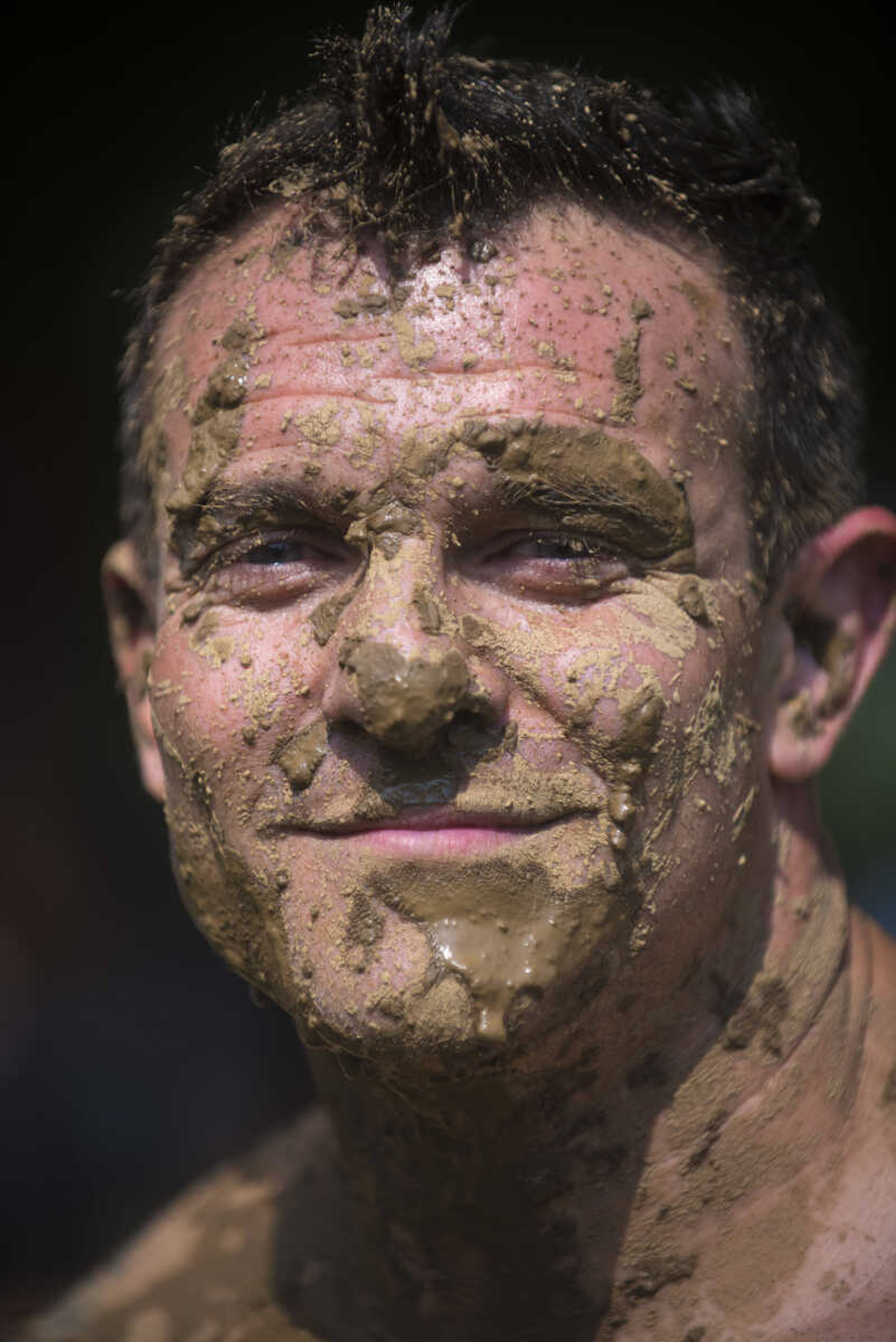 Joey Hann poses for a photo during mud volleyball for the Jackson Parks and Recreation's July 4th celebration Tuesday, July 4, 2017 in Jackson City Park.