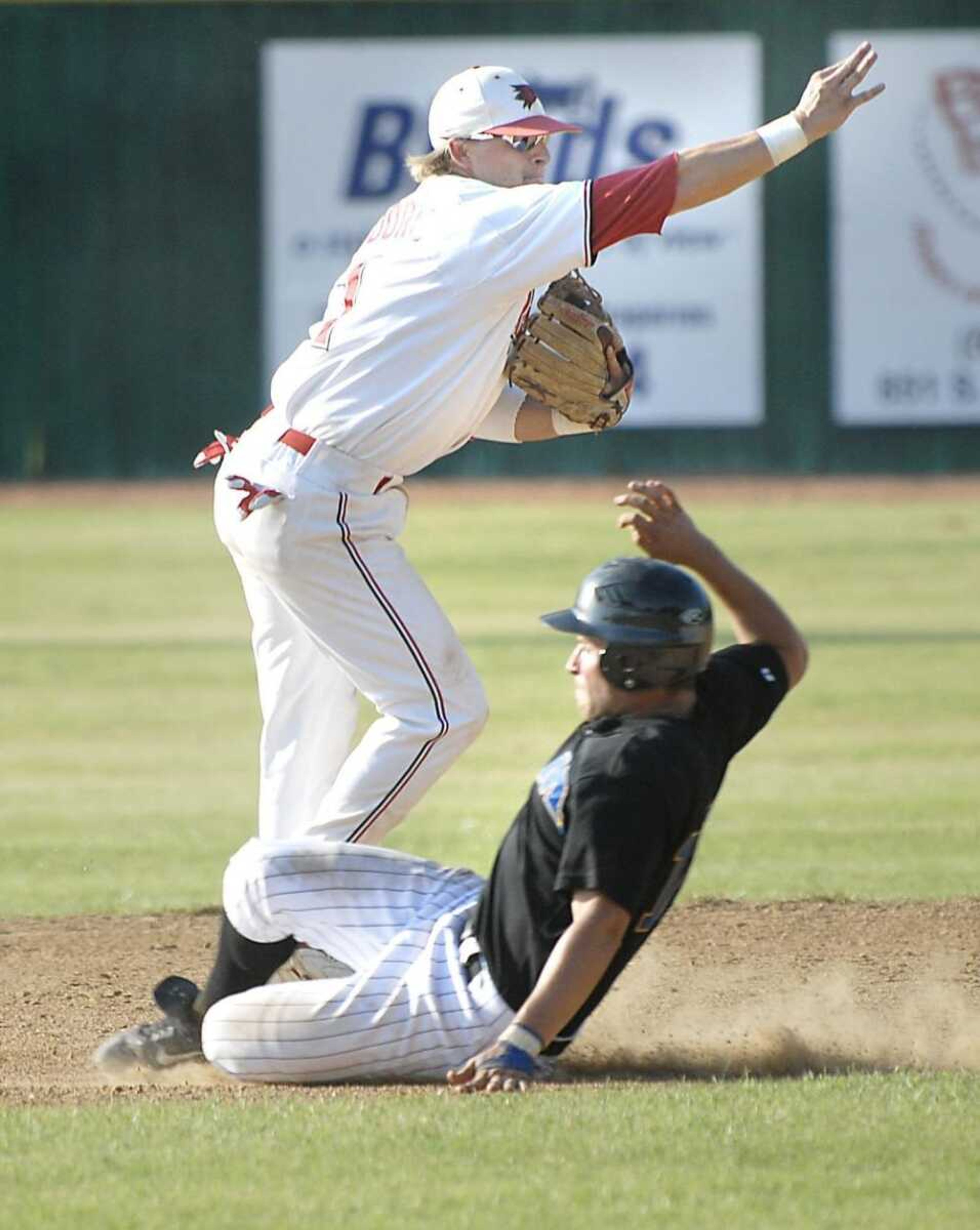 Redhawks shortstop Robby Moore completed a double play over Morehead State's Christian Winstanley during the second game of Saturday's doubleheader. (Kit Doyle)