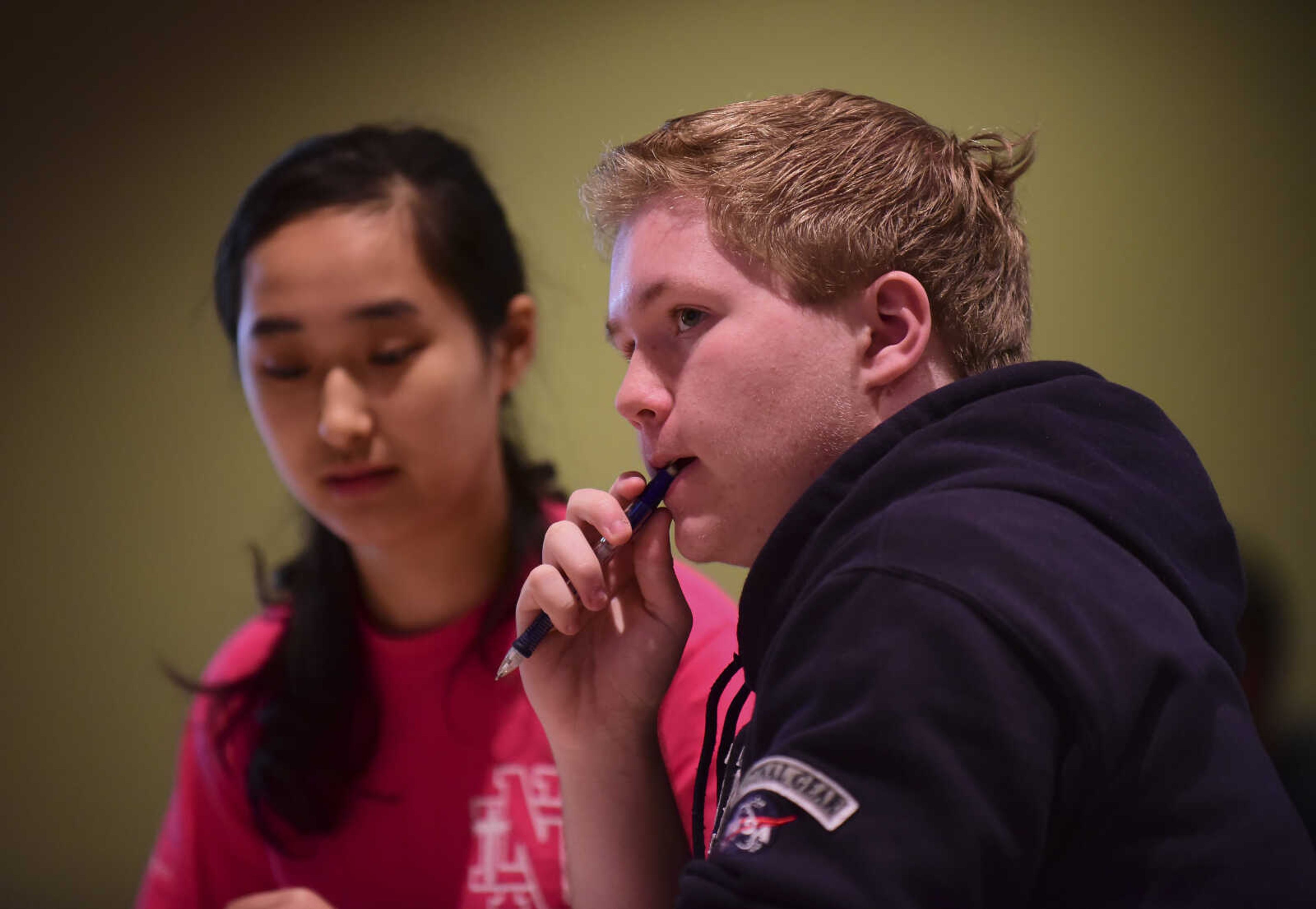 Jordan Bass, right, thinks about a problem while working with Linda Hu, left, from Notre Dame as they compete in the problem-solving event during the 40th annual Math Field Day Tuesday, April 18, 2017 at the University Center on the campus of Southeast Missouri State University in Cape Girardeau.