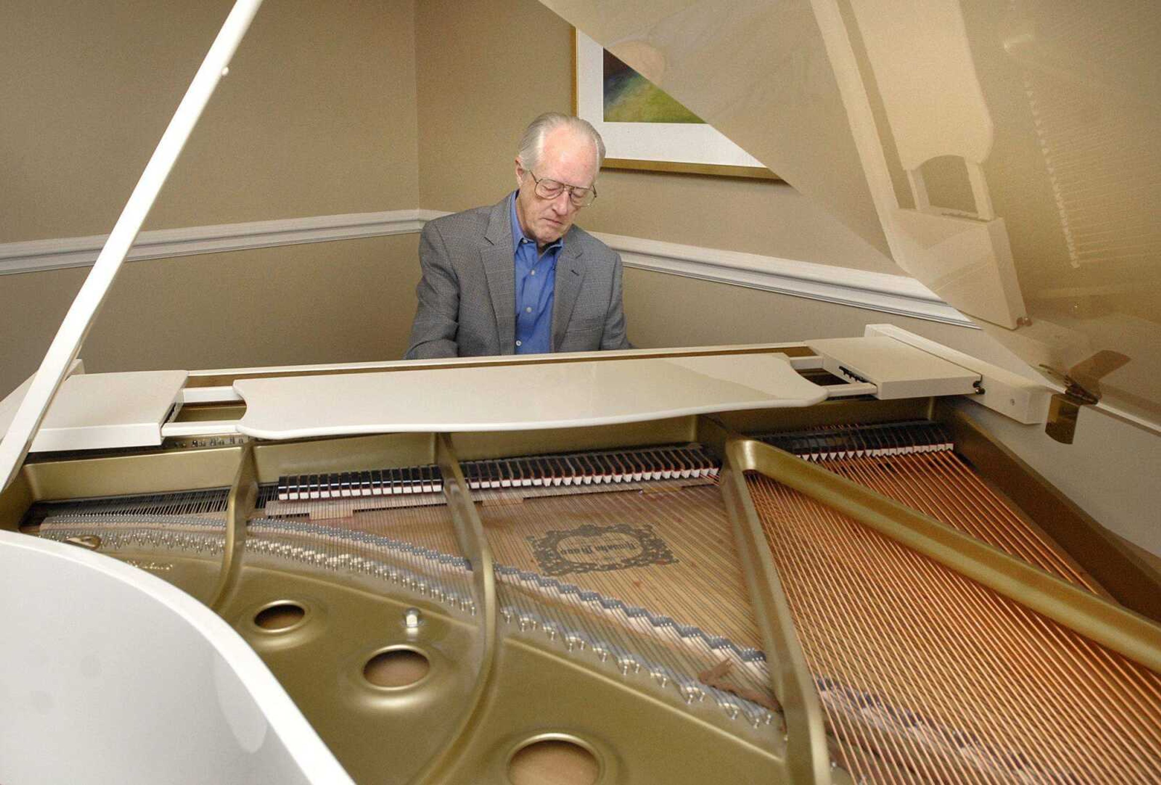 John Shelton plays a tune on the piano at Chateau Girardeau Tuesday morning, Feb. 28, 2012. Shelton will be giving a recital to celebrate his 80th birthday. (Laura Simon)