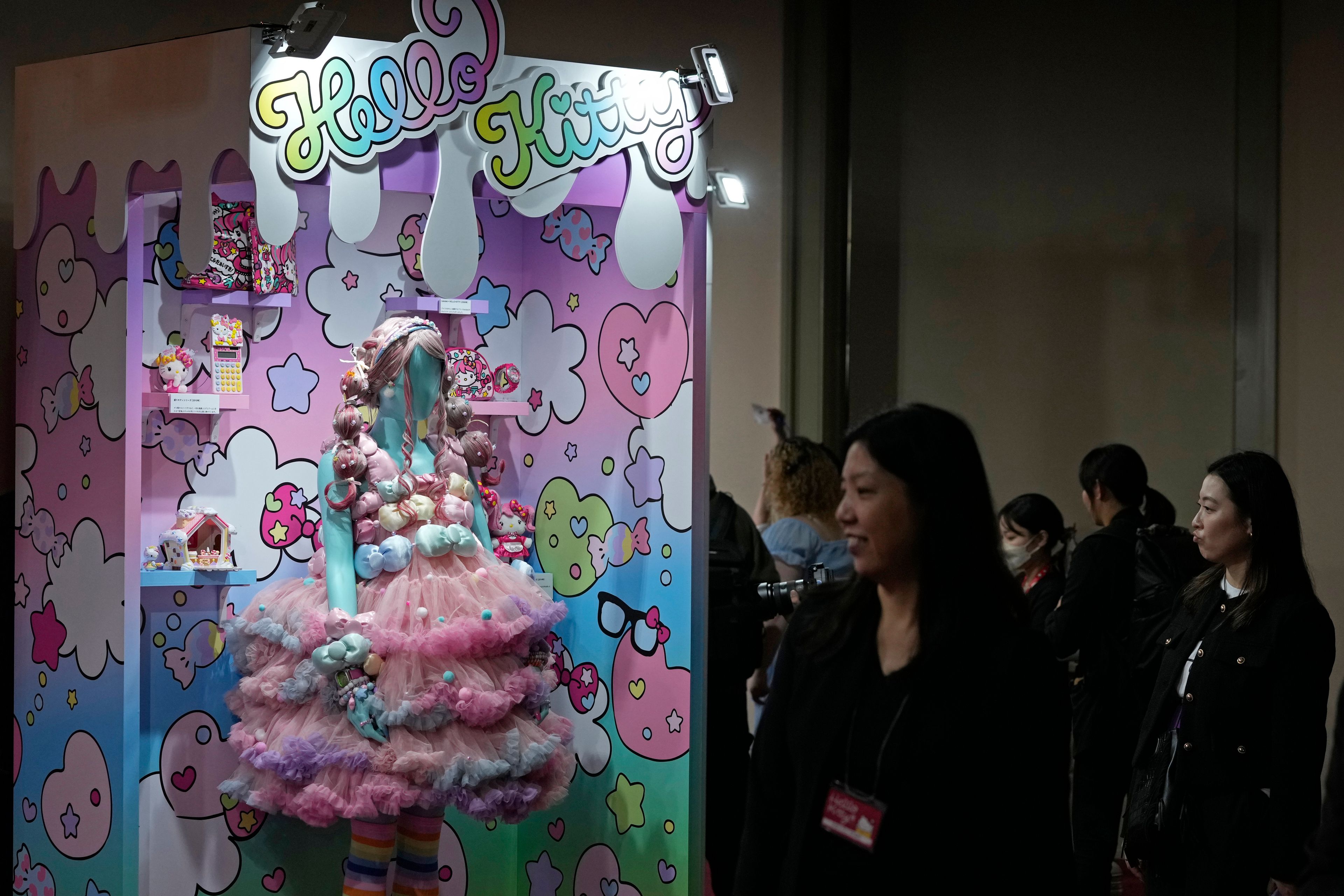 Visitors look at giant Hello Kitty decorations at the exhibition "As I change, so does she," marking the 50th anniversary of Hello Kitty at the Tokyo National Museum in Tokyo Wednesday, Oct. 30, 2024. (AP Photo/Shuji Kajiyama)