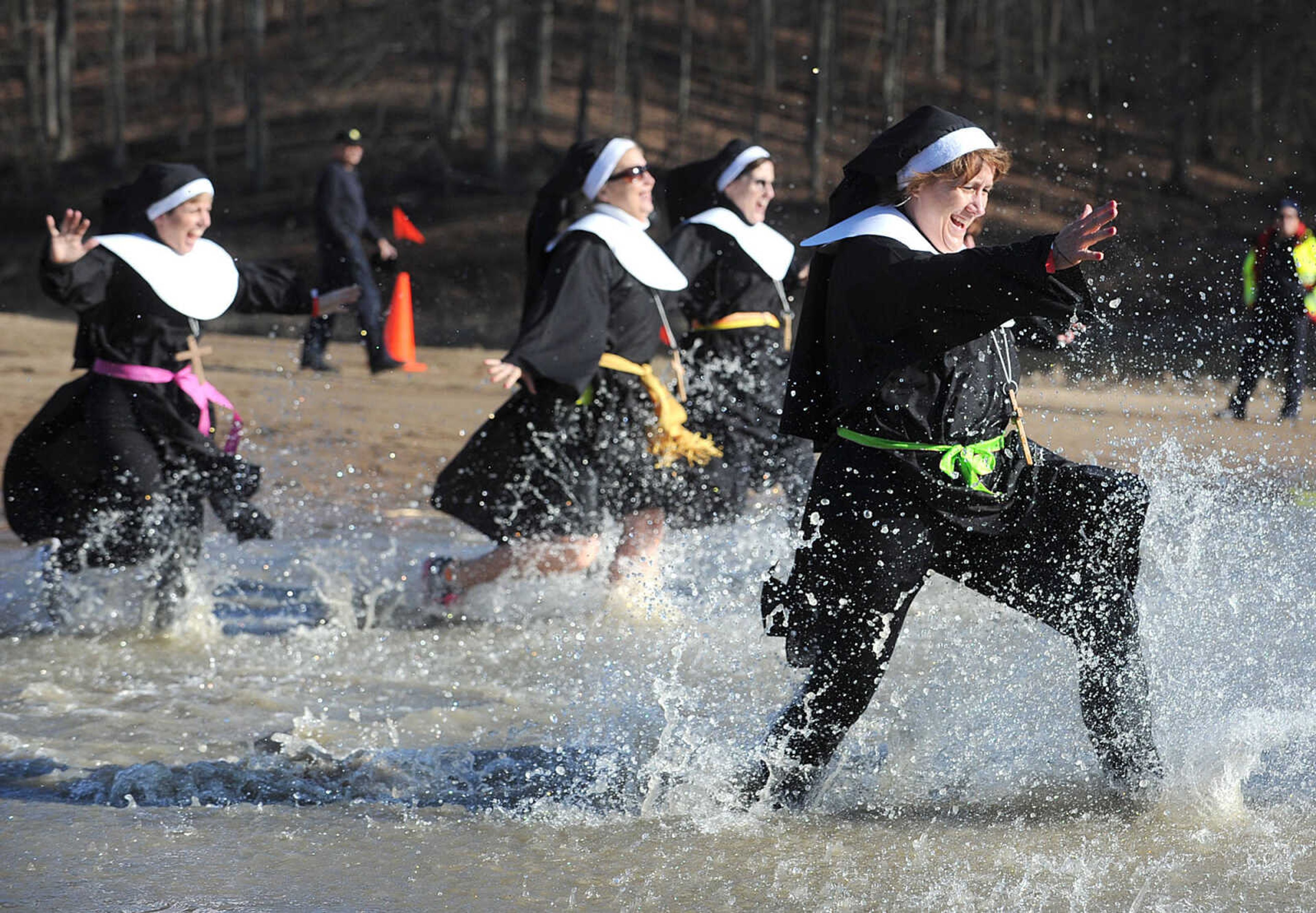 LAURA SIMON ~ lsimon@semissourian.com
People plunge into the cold waters of Lake Boutin Saturday afternoon, Feb. 2, 2013 during the Polar Plunge at Trail of Tears State Park. Thirty-six teams totaling 291 people took the annual plunge that benefits Special Olympics Missouri.