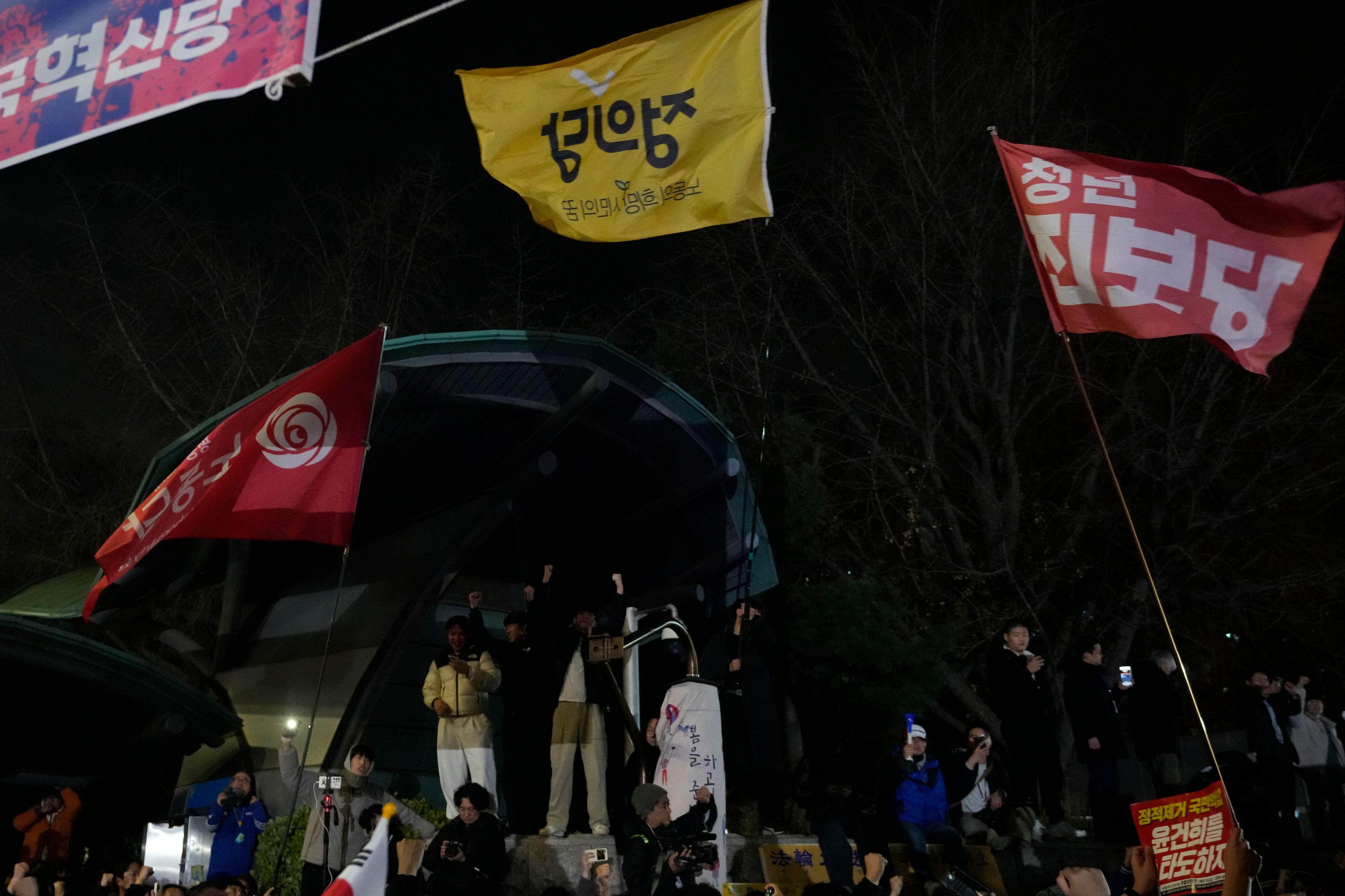 People gather in front of the National Assembly in Seoul, South Korea, Wednesday, Dec. 4, 2024. (AP Photo/Ahn Young-joon)