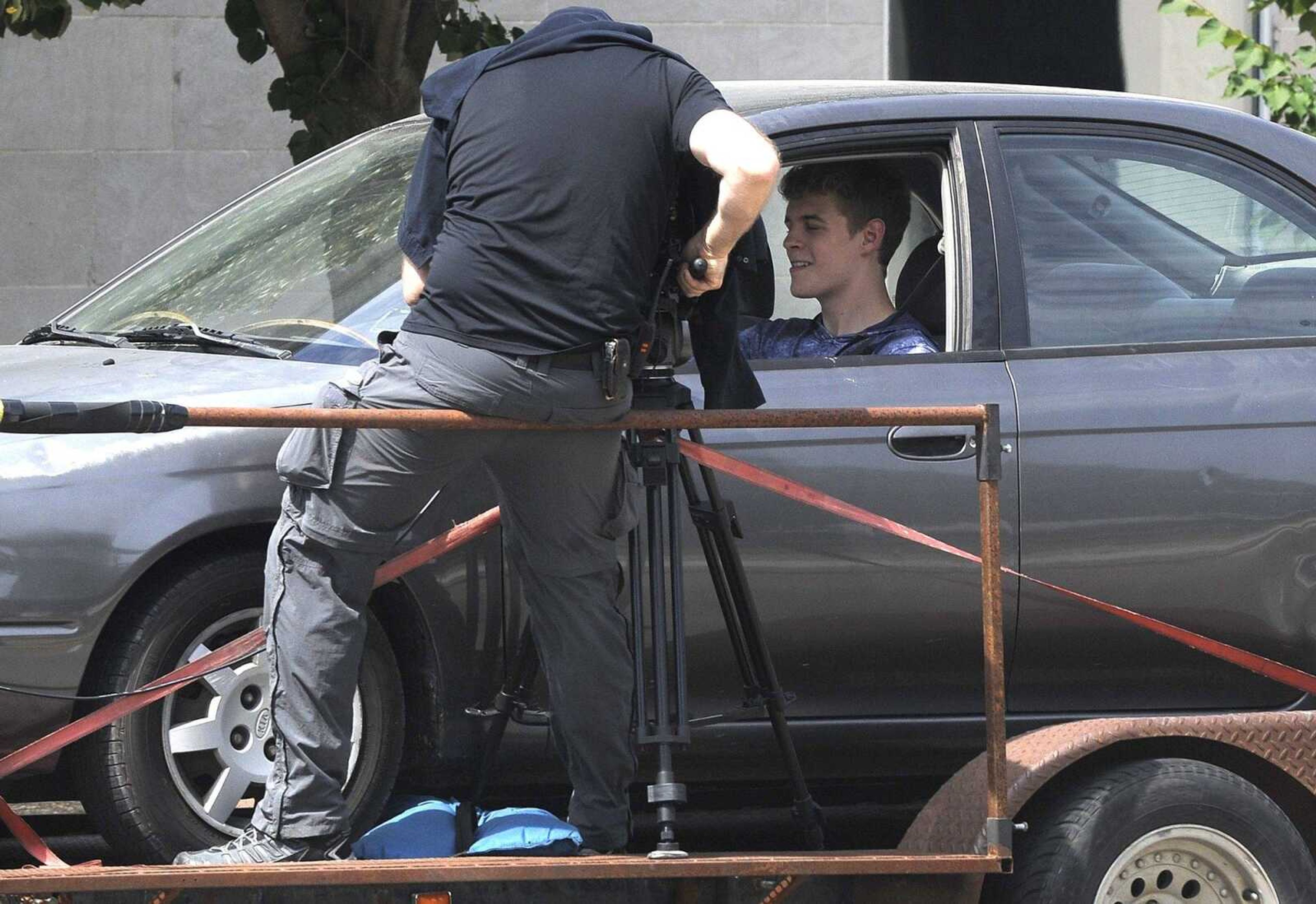 Actor Matt Mitchell shoots a scene with cinematographer PJ Gaynard for the movie "All Nite Skate" on Friday in uptown Jackson.