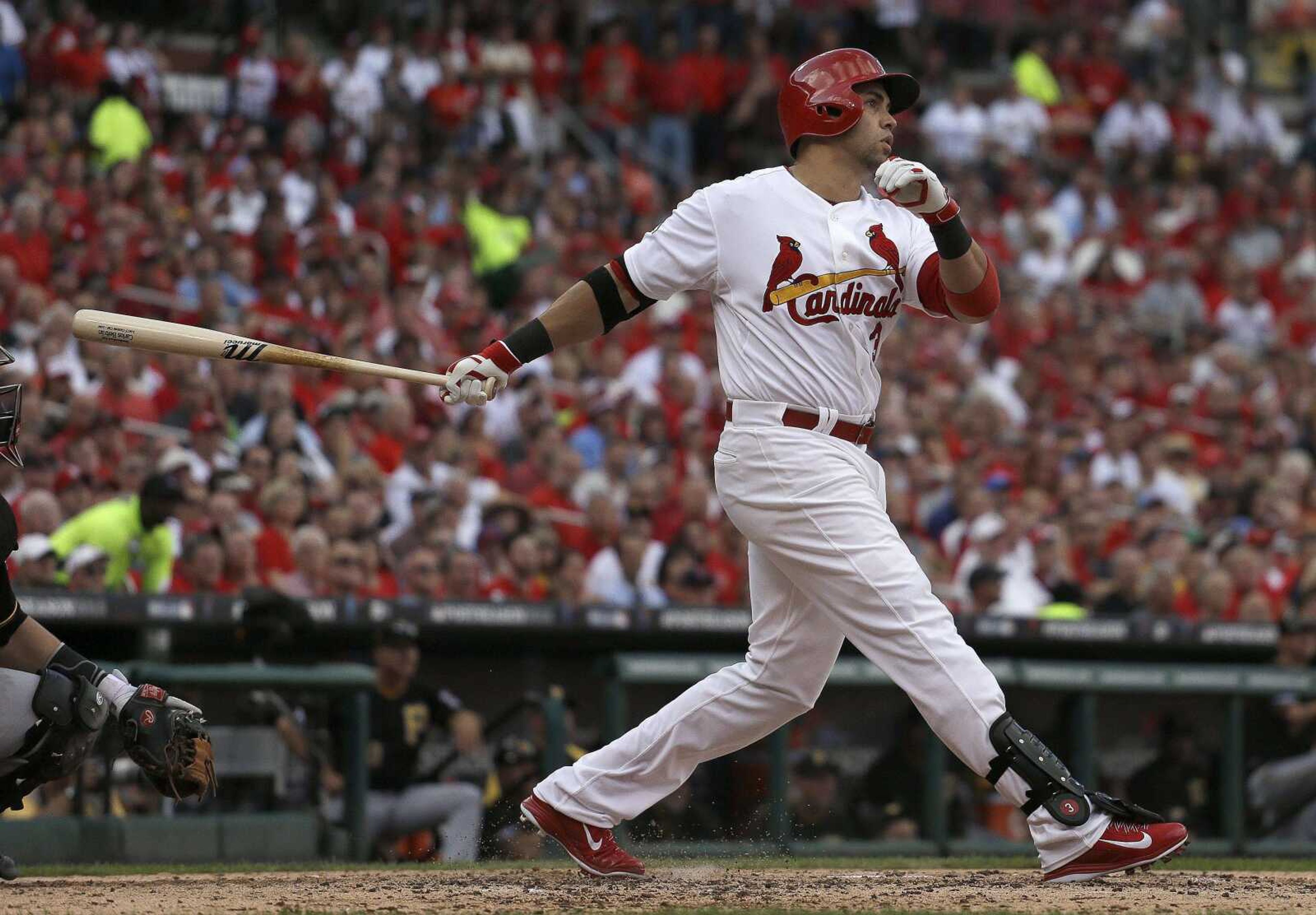 The Cardinals&#8217; Carlos Beltran follows through on a three-run home run against the Pirates during the third inning of Game 1 of their National League division series Thursday in St. Louis. (Jeff Roberson ~ Associated Press)