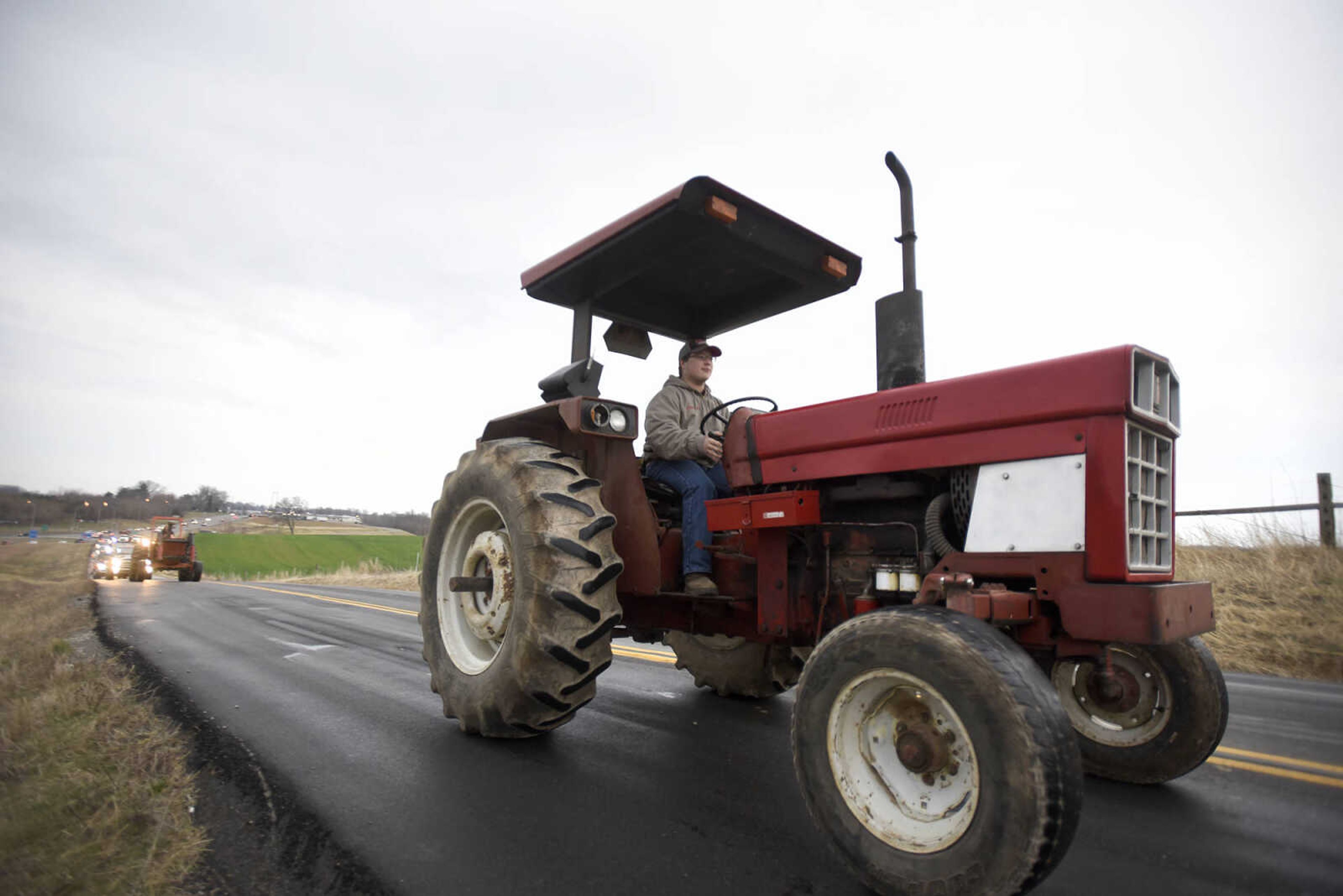 Saxony Lutheran High School FFA students take to the road on their tractors during drive your tractor to school day on Tuesday morning, Feb. 21, 2017. Students began their journey to school from Davis Farm Supply on Highway 61 in Jackson as part of FFA Week.