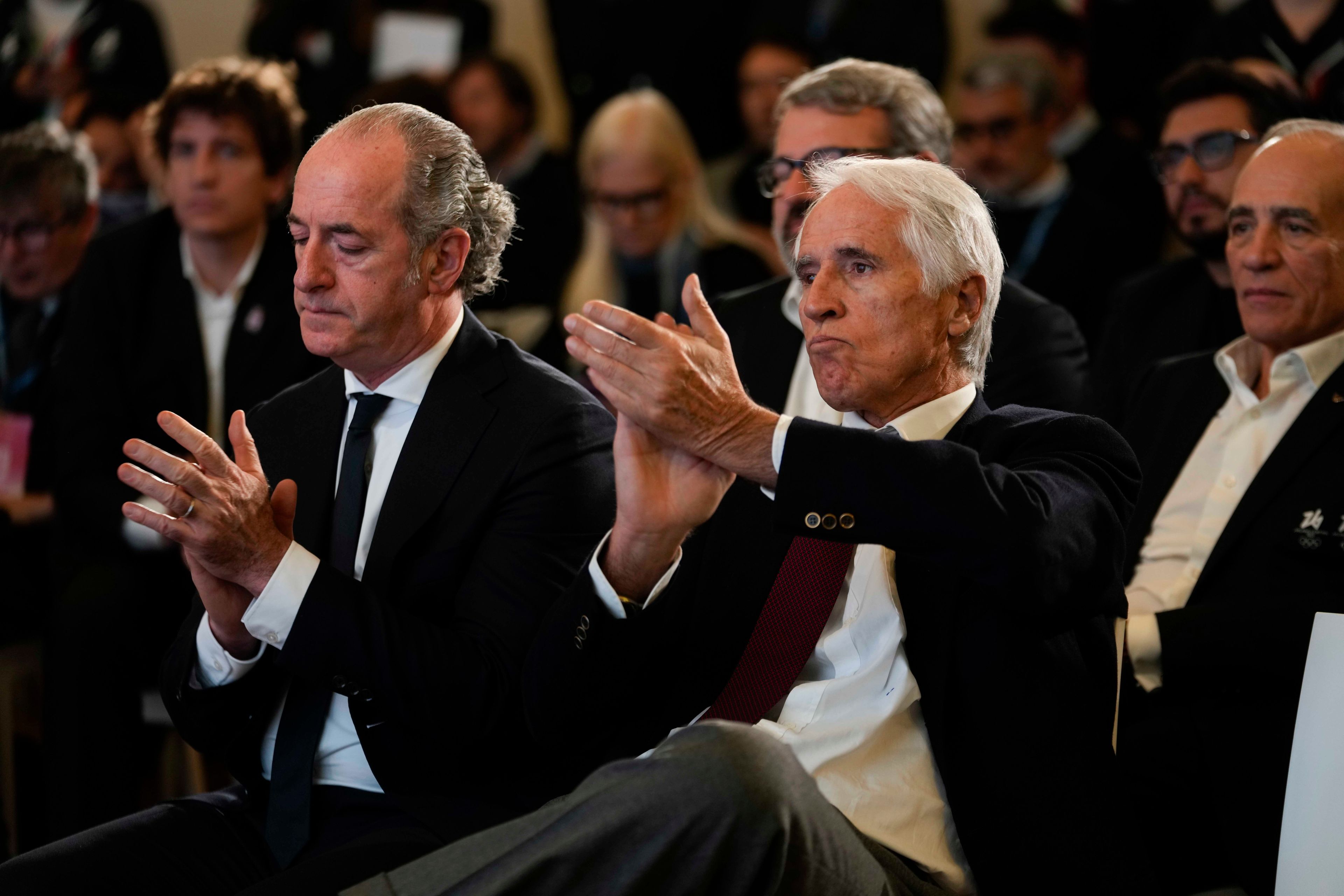 President of the Italian National Olympic Committee, Giovanni Malago' is flanked by President of the Veneto Region Luca Zaia during a news conference to present the route of the 2026 Winter Olympics and Paralympics torch route, in Verona, Italy, Tuesday, Nov. 26, 2024. (AP Photo/Luca Bruno)