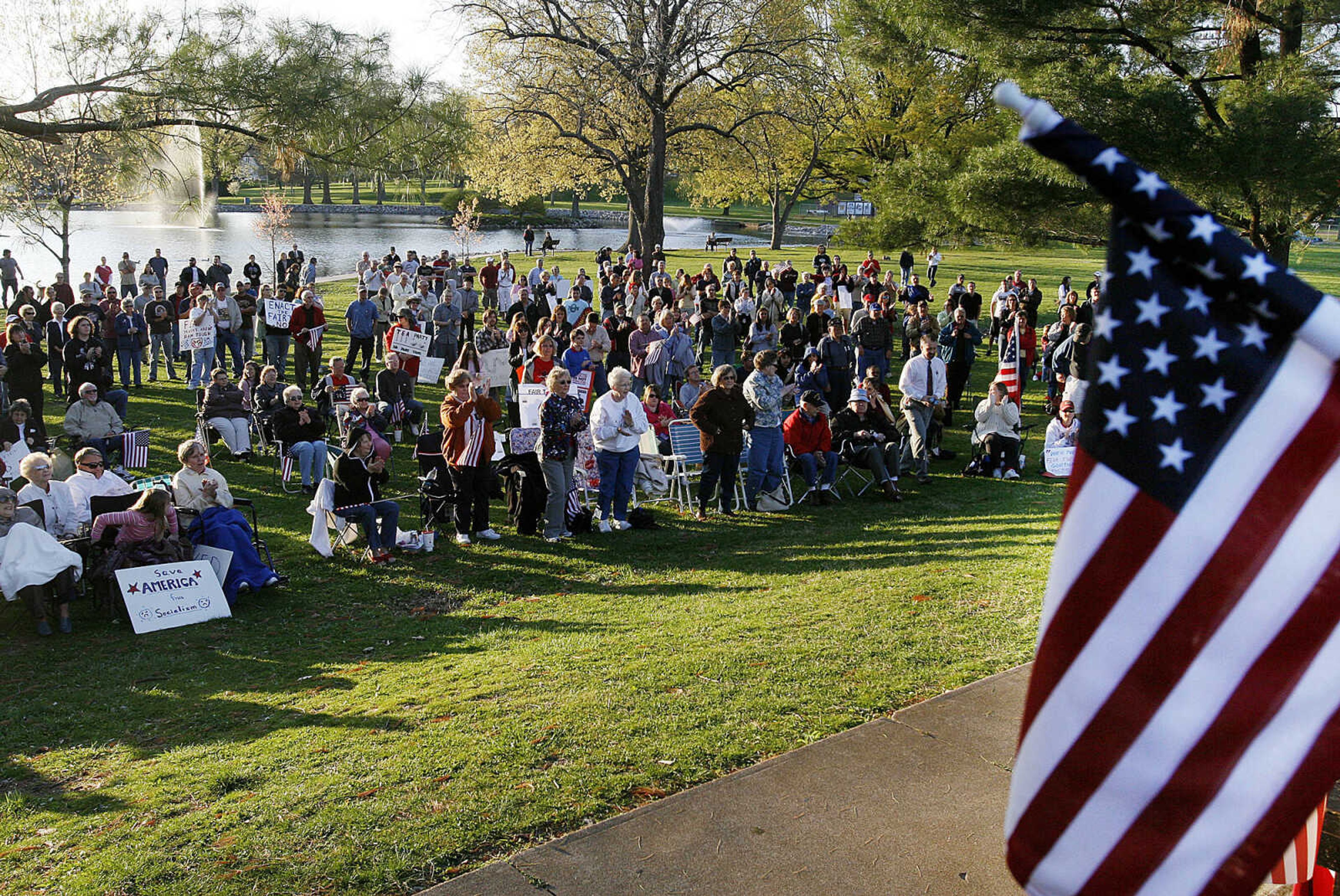 ELIZABETH DODD ~ edodd@semissourian.com
A crowd of about 600 people listens to speakers at a "tea party" tax protest at Capaha Park Wednesday. The rally was called a "tea party to model the Boston Tea Party staged by American colonists against British taxes in 1773.