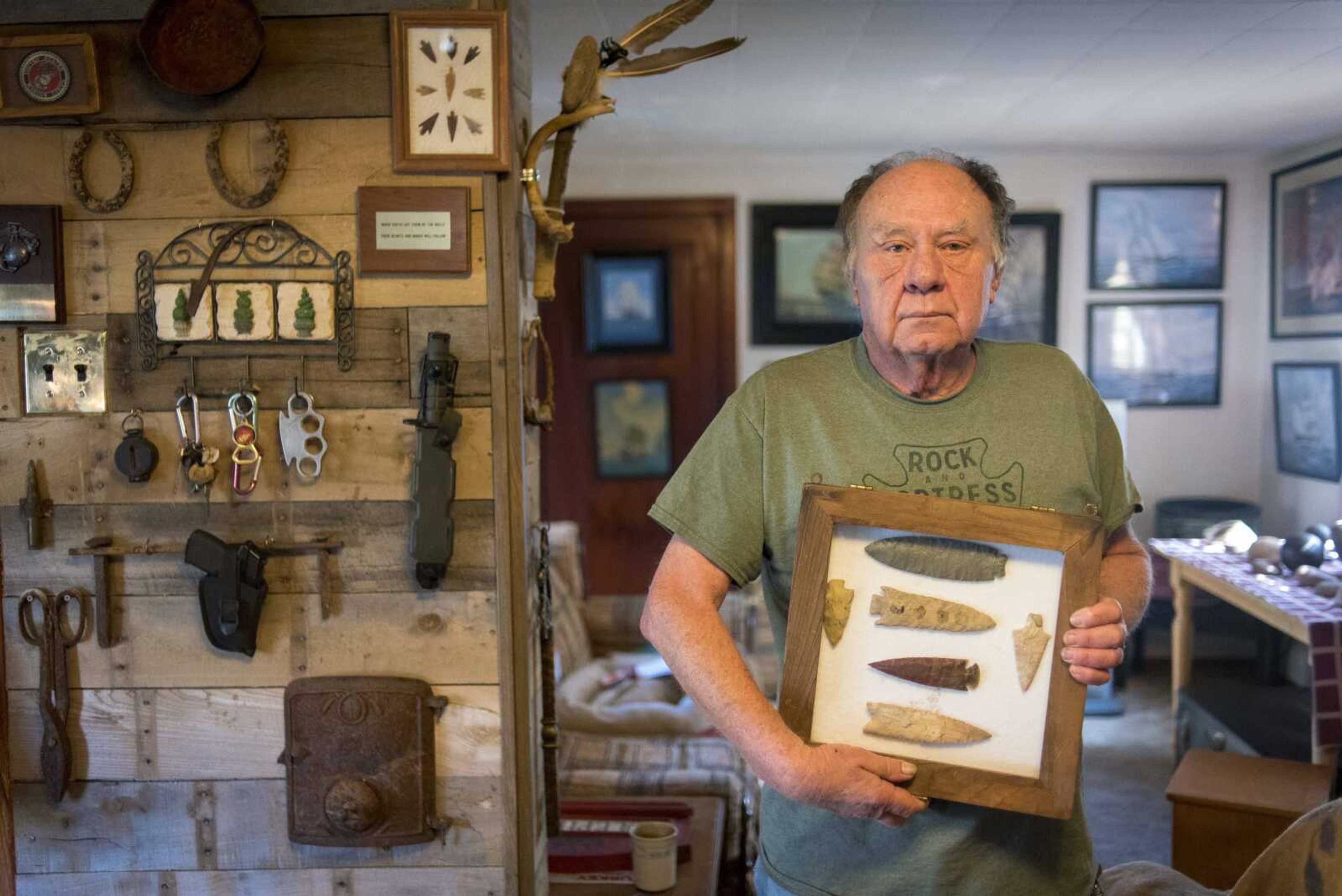 Cutline-Body Copy:"Seventy percent I find, 20 percent I buy from Southeast Missouri towns and about 10 percent I trade for," Emmett "Butch" Bounds, 65, says, referring to his arrowhead collection. Bounds is seen holding his favorite arrowheads in his living room Thursday, Nov. 16, in Cape Girardeau. Bounds says it gets him out of the house and gives him something to do.