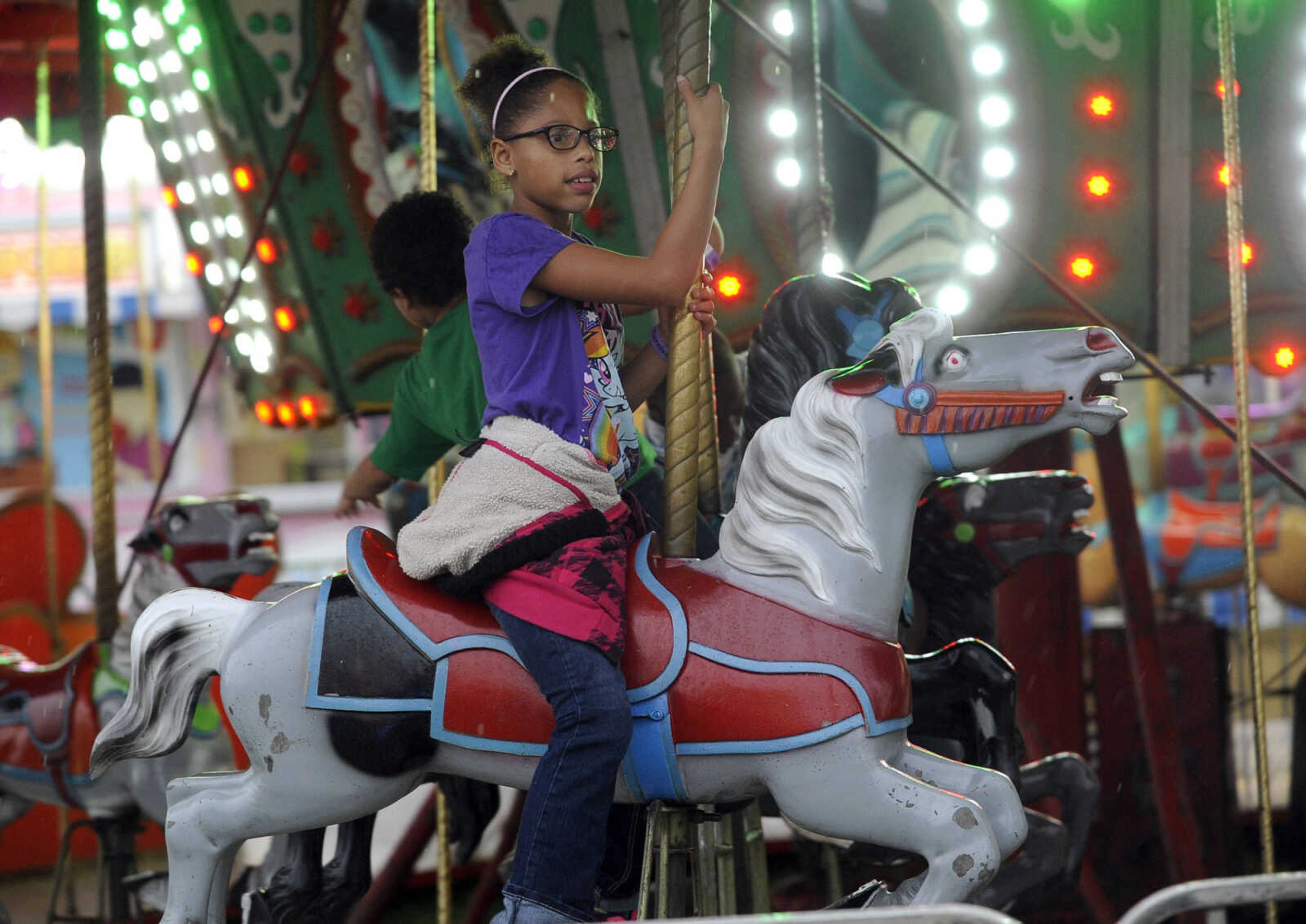 FRED LYNCH ~ flynch@semissourian.com
The carousel is a favorite ride on a rainy day Thursday, Sept. 15, 2016 at the SEMO District Fair in Cape Girardeau.