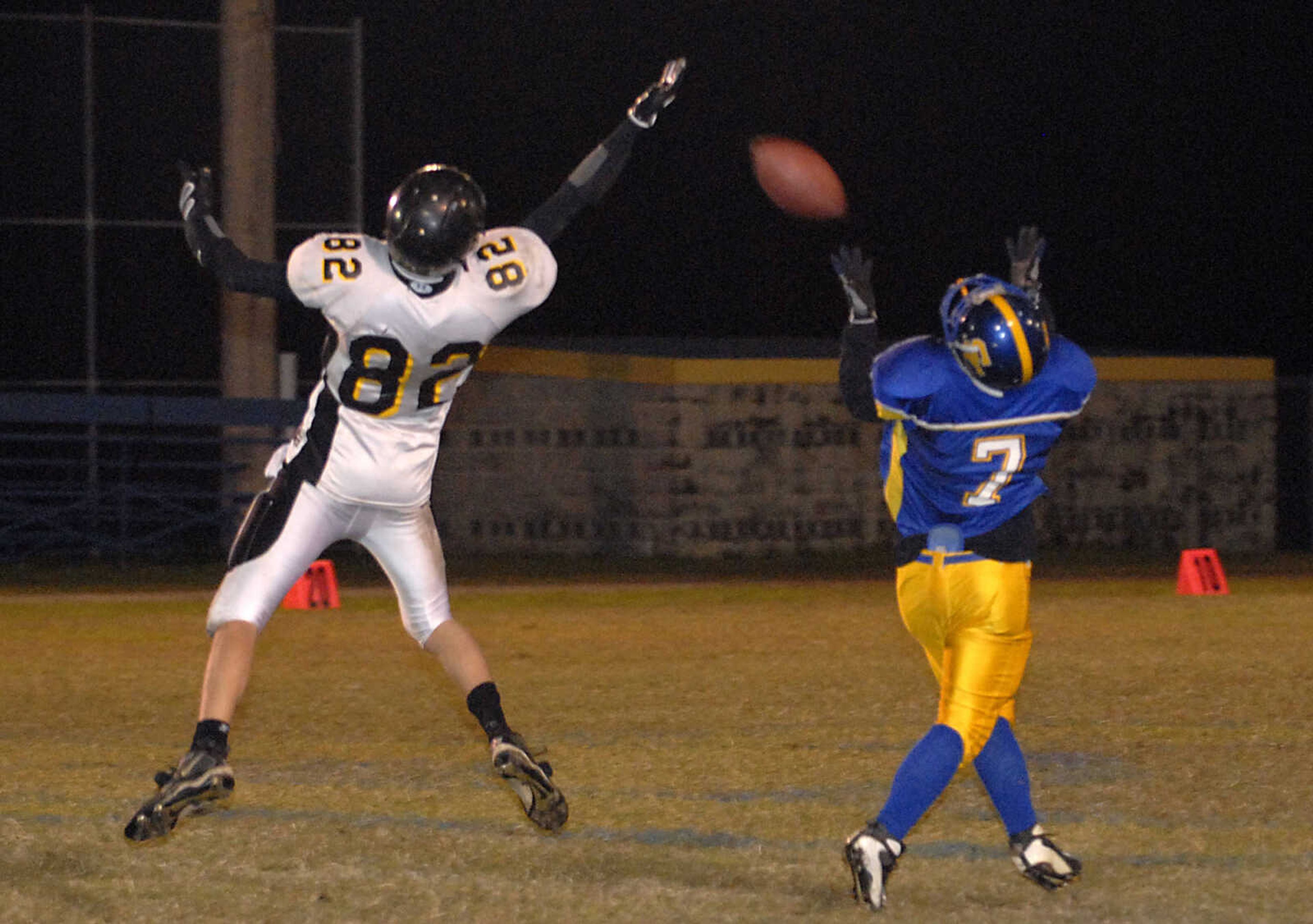 KIT DOYLE ~ kdoyle@semissourian.com
Scott City tight end Zach Pobst makes an over-the-shoulder catch as Grandview's Nick Robinson defenders Friday, Ocotber 16, 2009, in Scott City.  Pobst ran it in for a touchdown.