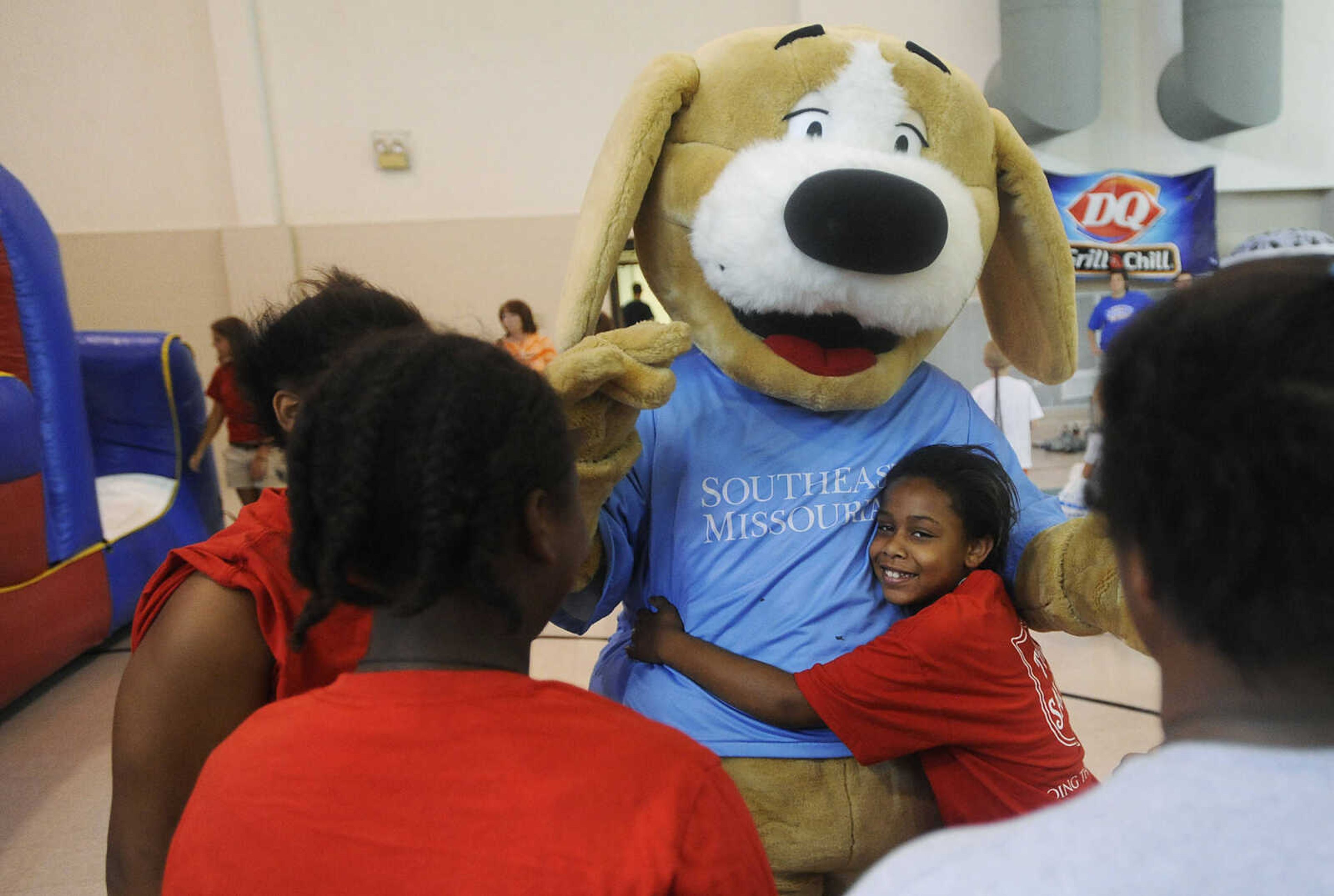 ADAM VOGLER ~ avogler@semissourian.com
Children surround Tracker wanting hugs during the 11th annual Cape Girardeau Parks and Rec Day Friday, July 13, at the Osage Center.