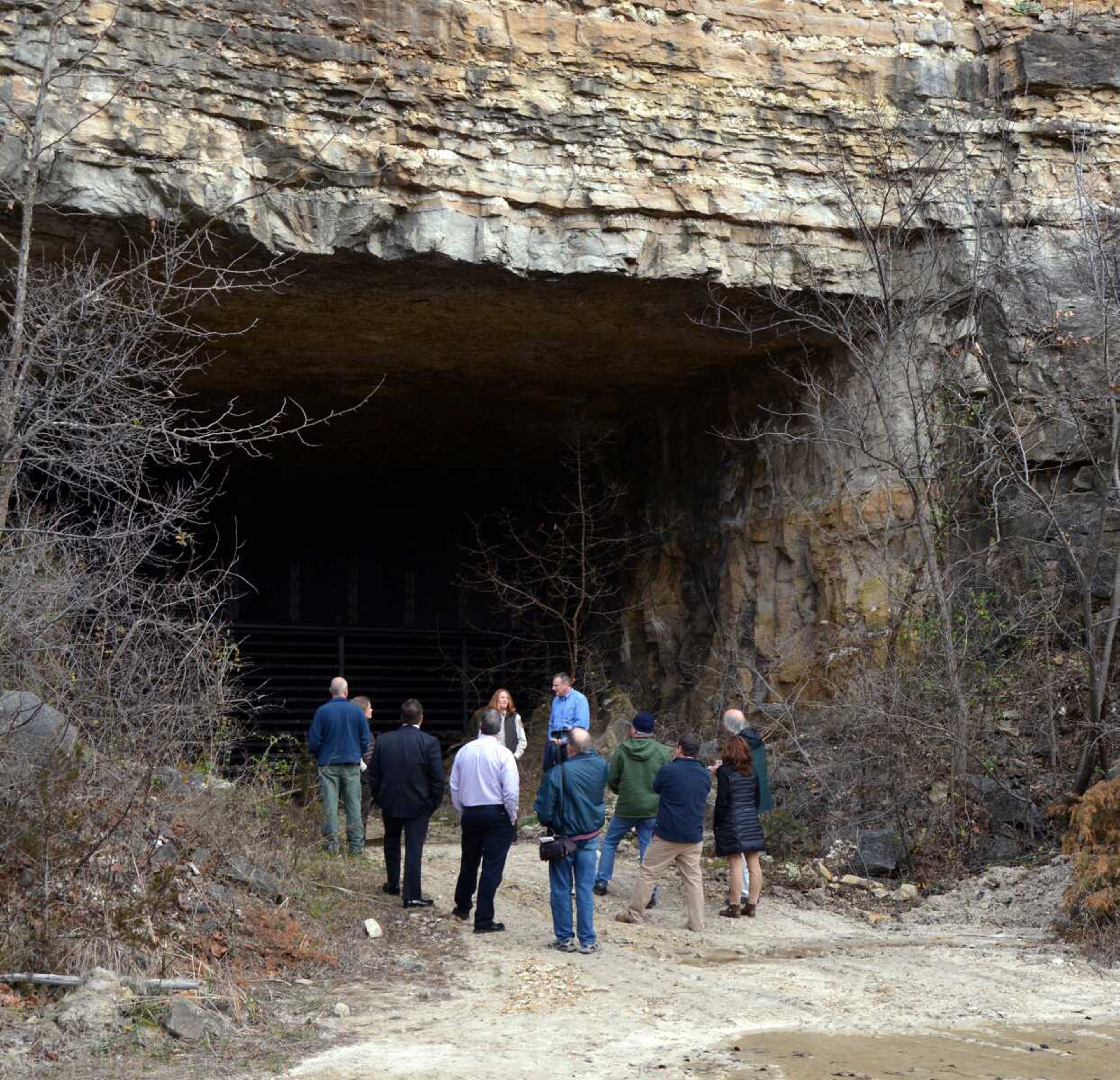 USFWL personal and partners talk Dec. 11 at what will be come a 185-acre nature preserve in Hannibal, Missouri. Caves and an old limestone mine there serve as the winter hibernation home for tens of thousands of federally endangered Indiana bats. (U.S. Fish and Wildlife Service via AP)