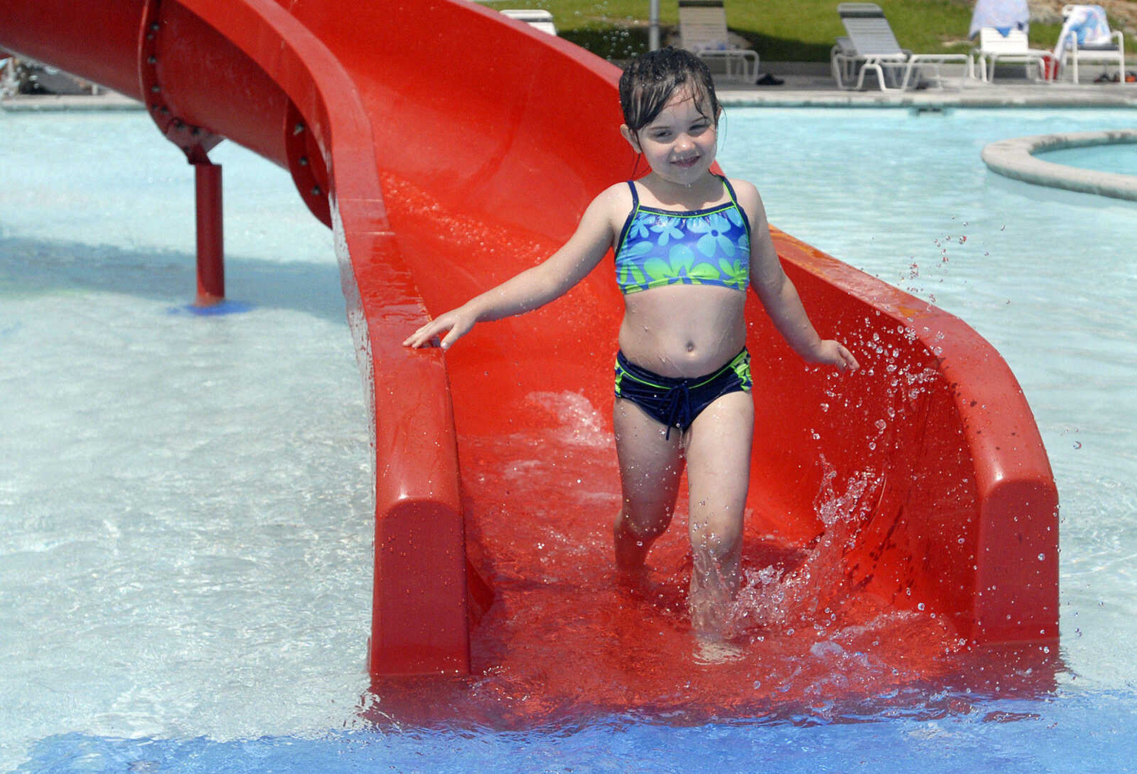 LAURA SIMON~lsimon@semissourian.com
Savannah Jones, 5, of Puxico, Mo. runs down the slide in the play pool area Saturday, May 28, 2011 during opening day of Cape Splash Family Aquatic Center in Cape Girardeau.