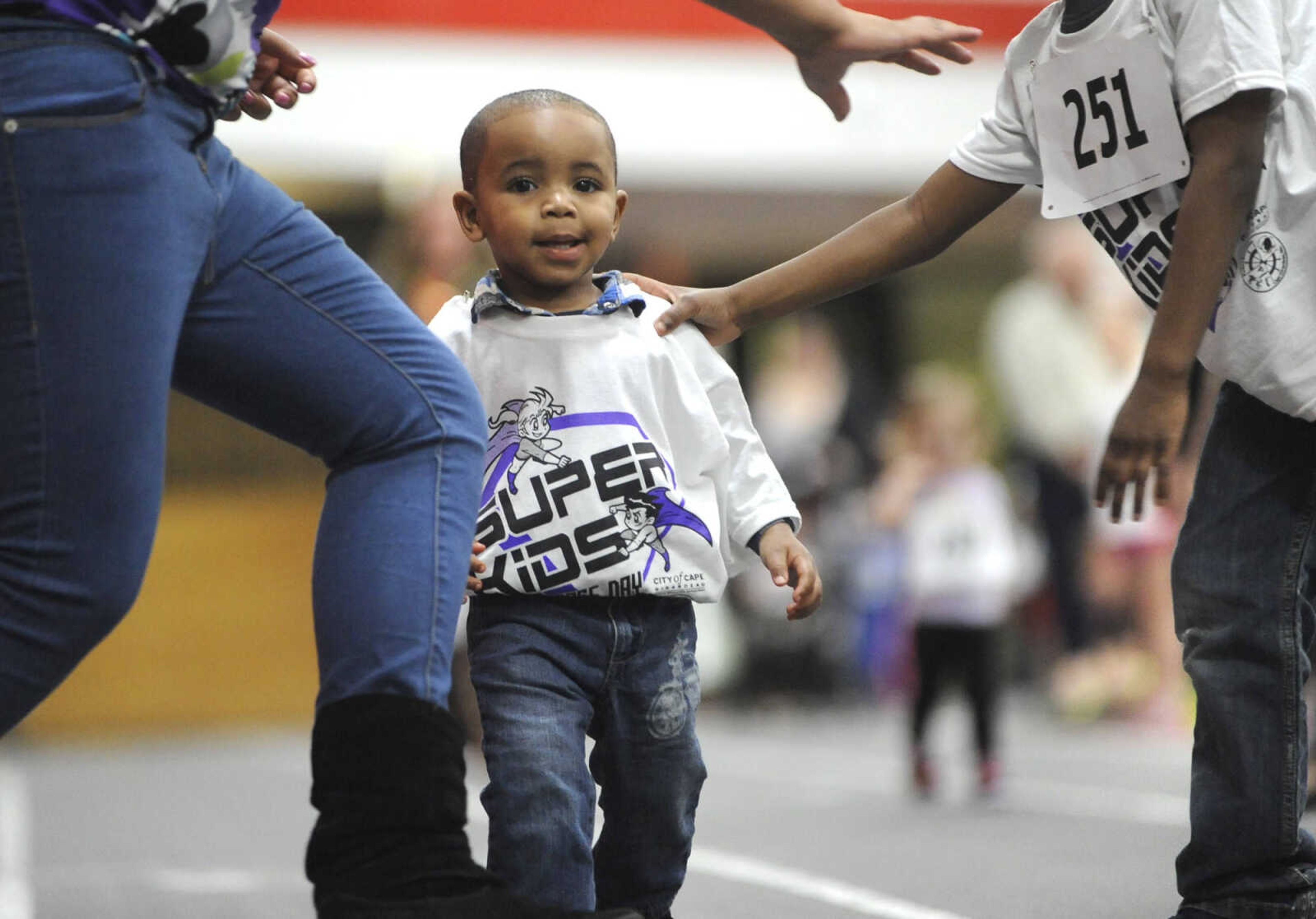 FRED LYNCH ~ flynch@semissourian.com
Lance Lewis gets a little help at the finish line in a 50-meter run for 1-year-olds at the Super Kids Race Day on Sunday, Feb. 7, 2016 at the Student Recreation Center.