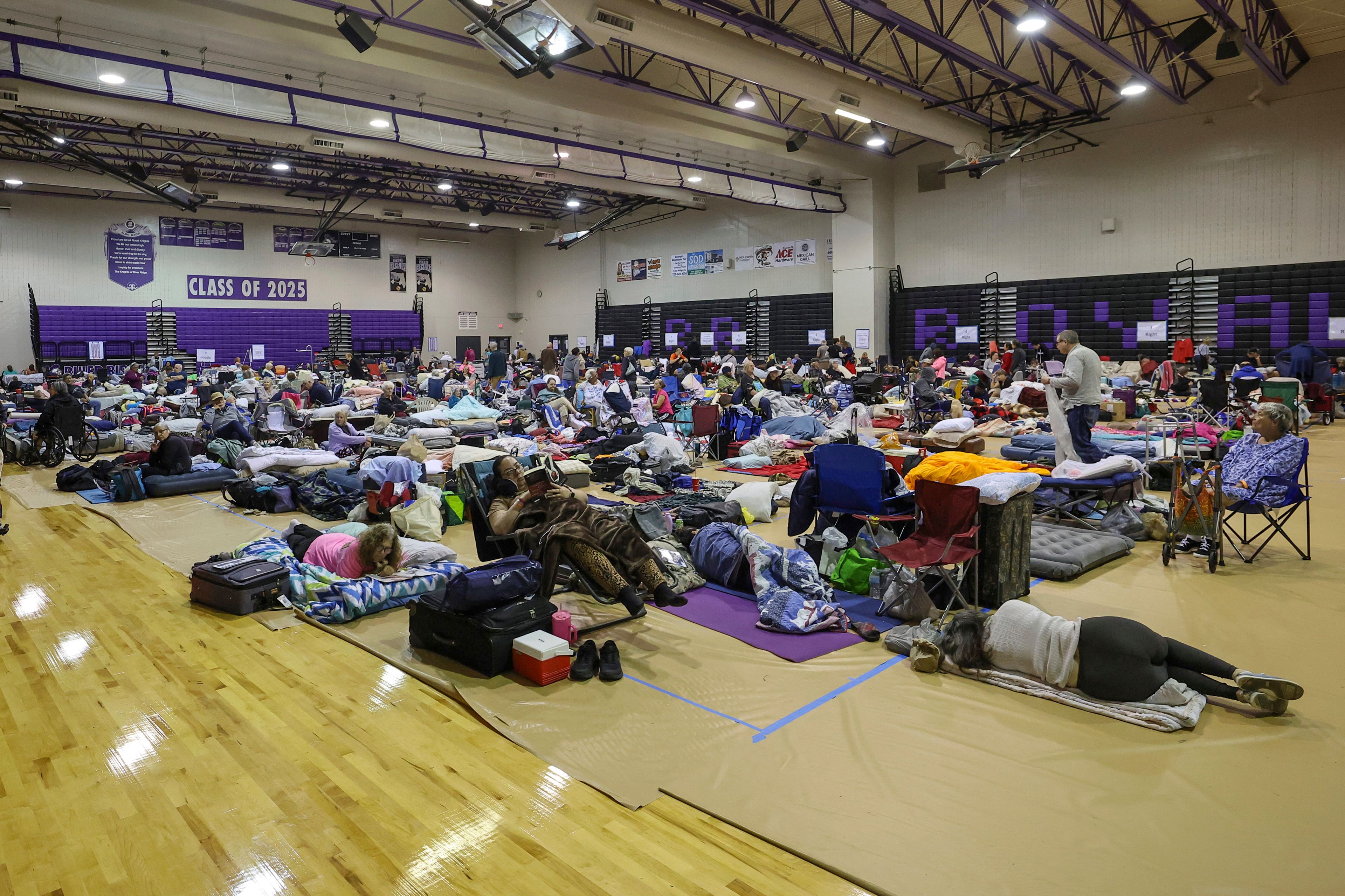 A view of some of the 700 evacuees in the gymnasium in shelter at River Ridge Middle/High School in preparation for Hurricane Milton on Wednesday, Oct. 9,  in New Port Richey, Florida.