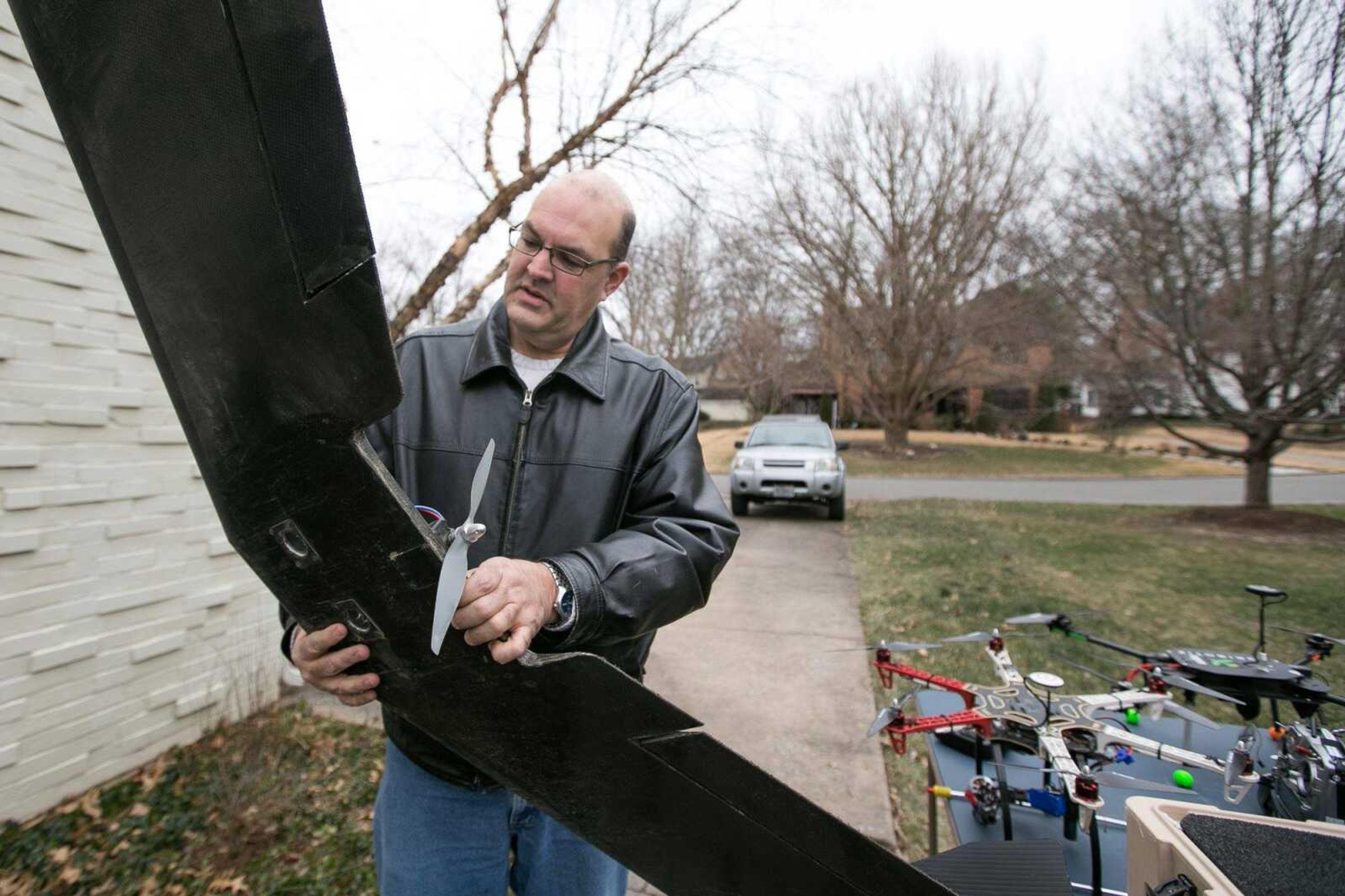 Andrew Chronister explains the features of his fixed-wing drone used to survey agricultural crops. The FAA announced Tuesday a new set of rules for drones used for commercial purposes.