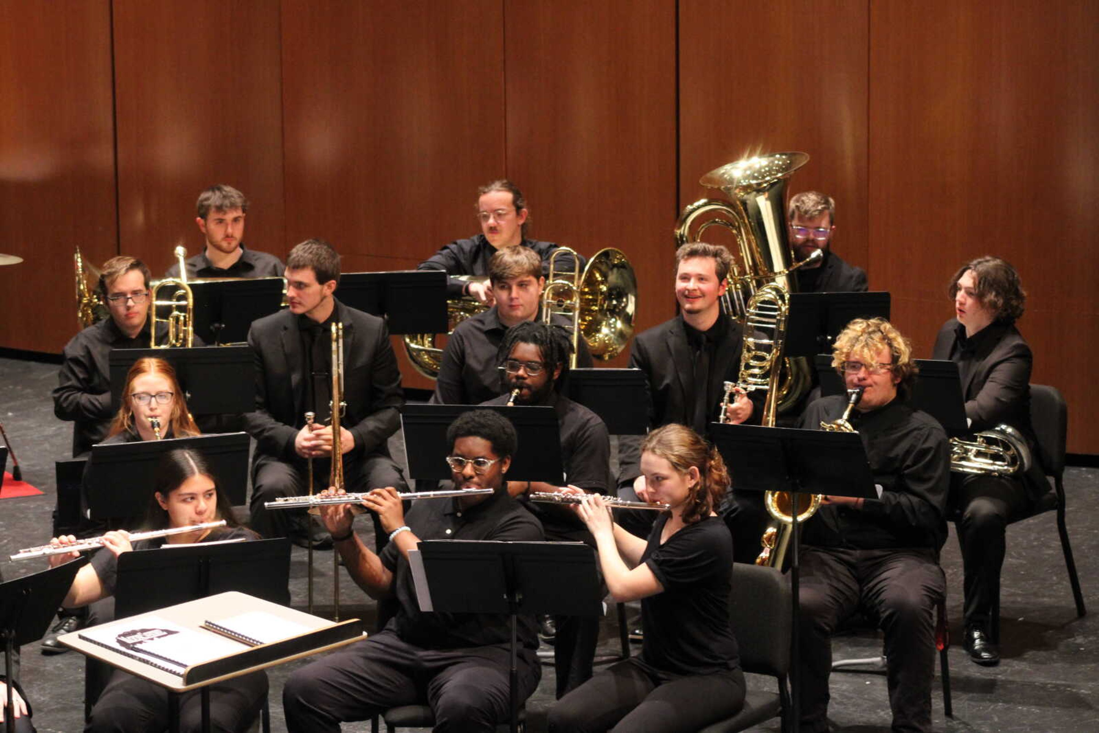 The University Concert Band practices before the show starts.