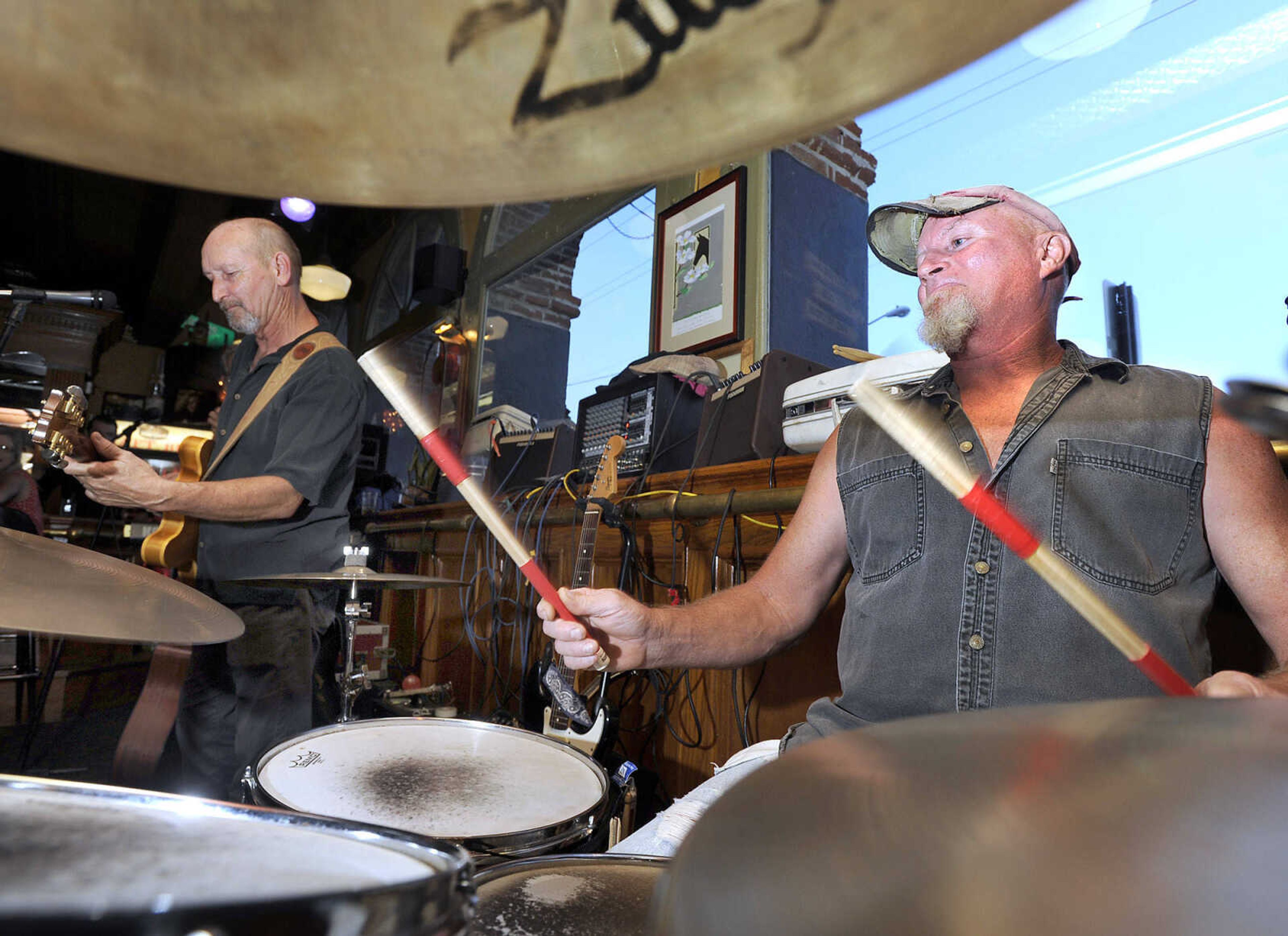 FRED LYNCH ~ flynch@semissourian.com
Bruce Zimmerman, left, leads the Water Street Band as Danny Rees keeps the beat in their final Sunday night gig in the Water Street Lounge at Port Cape Girardeau Sunday night, July 12, 2015 in Cape Girardeau. Port Cape has ended a 26-year run of the Sunday night music sessions.